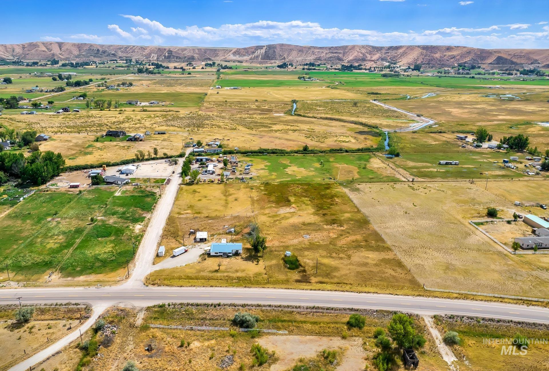 View of property location with rural landscape and a mountain backdrop