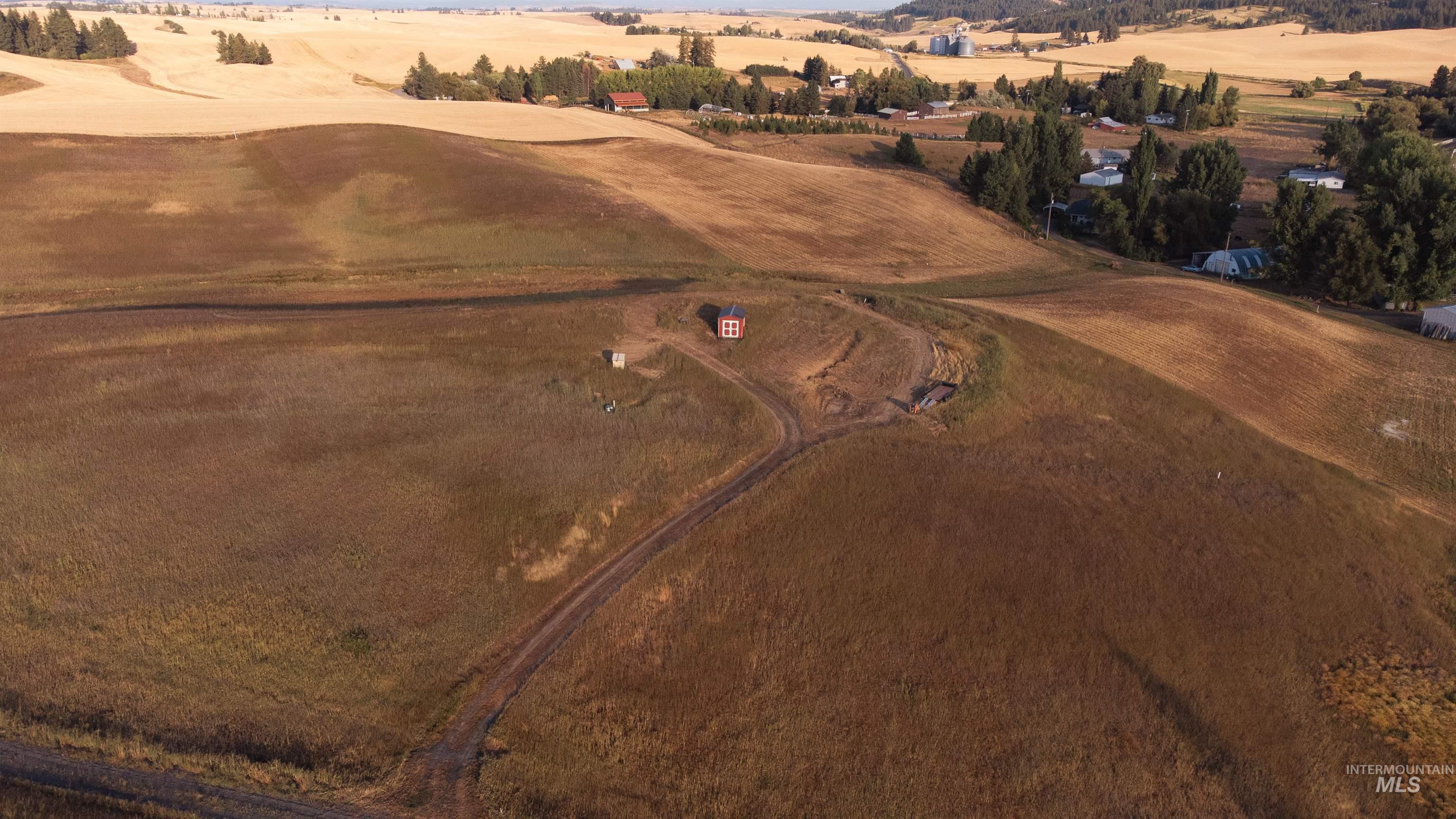 Aerial overview of property's location from NW Corner featuring property parcel outlined.