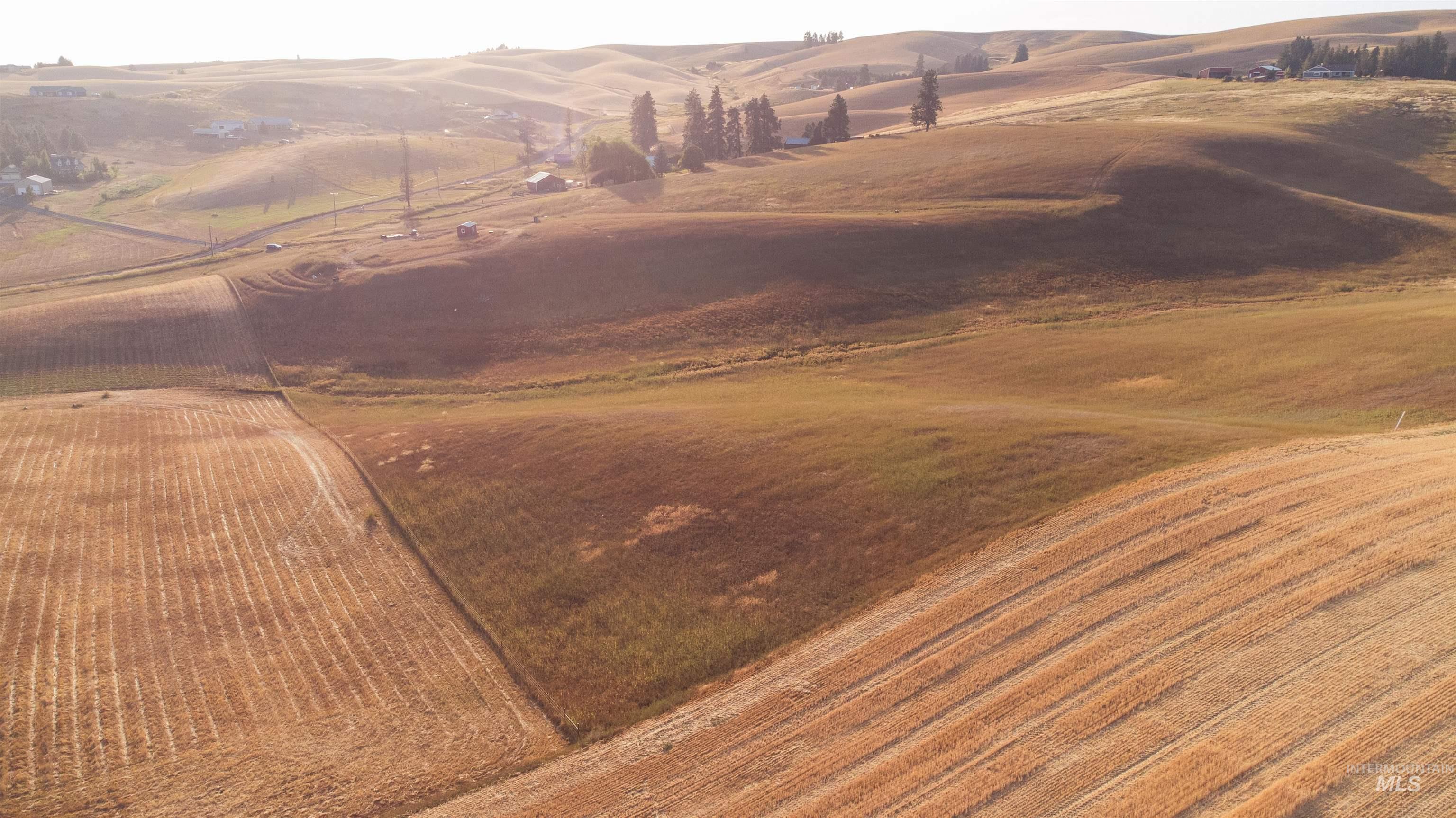 Aerial overview of property's location from SE Corner featuring property parcel outlined.