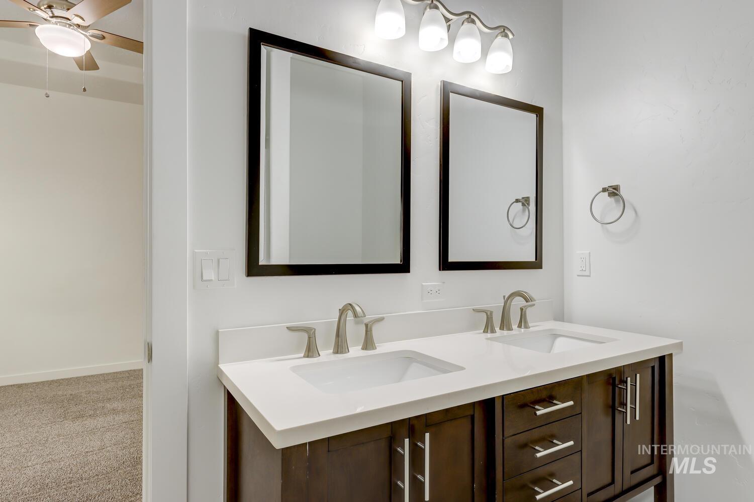 Full bathroom featuring double vanity