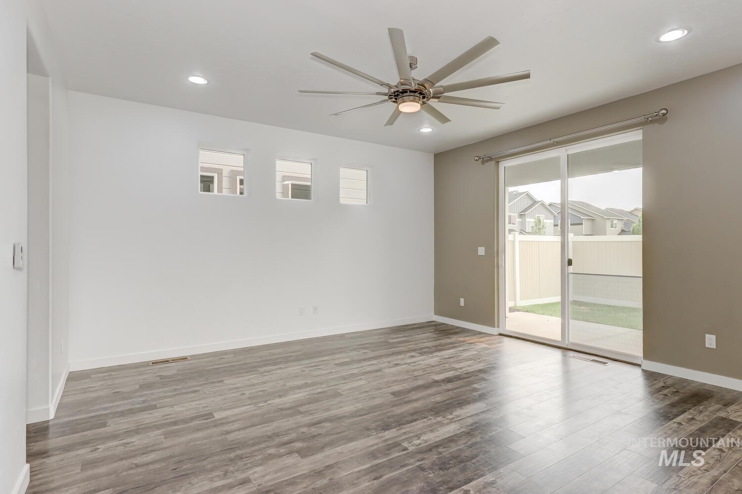 Spare room with recessed lighting, wood finished floors, and a ceiling fan