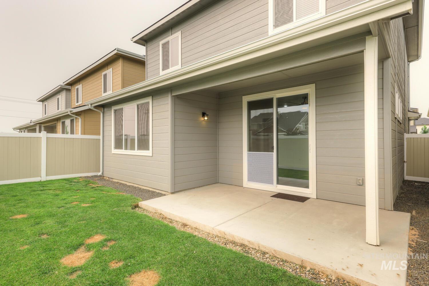 Rear view of house with a patio