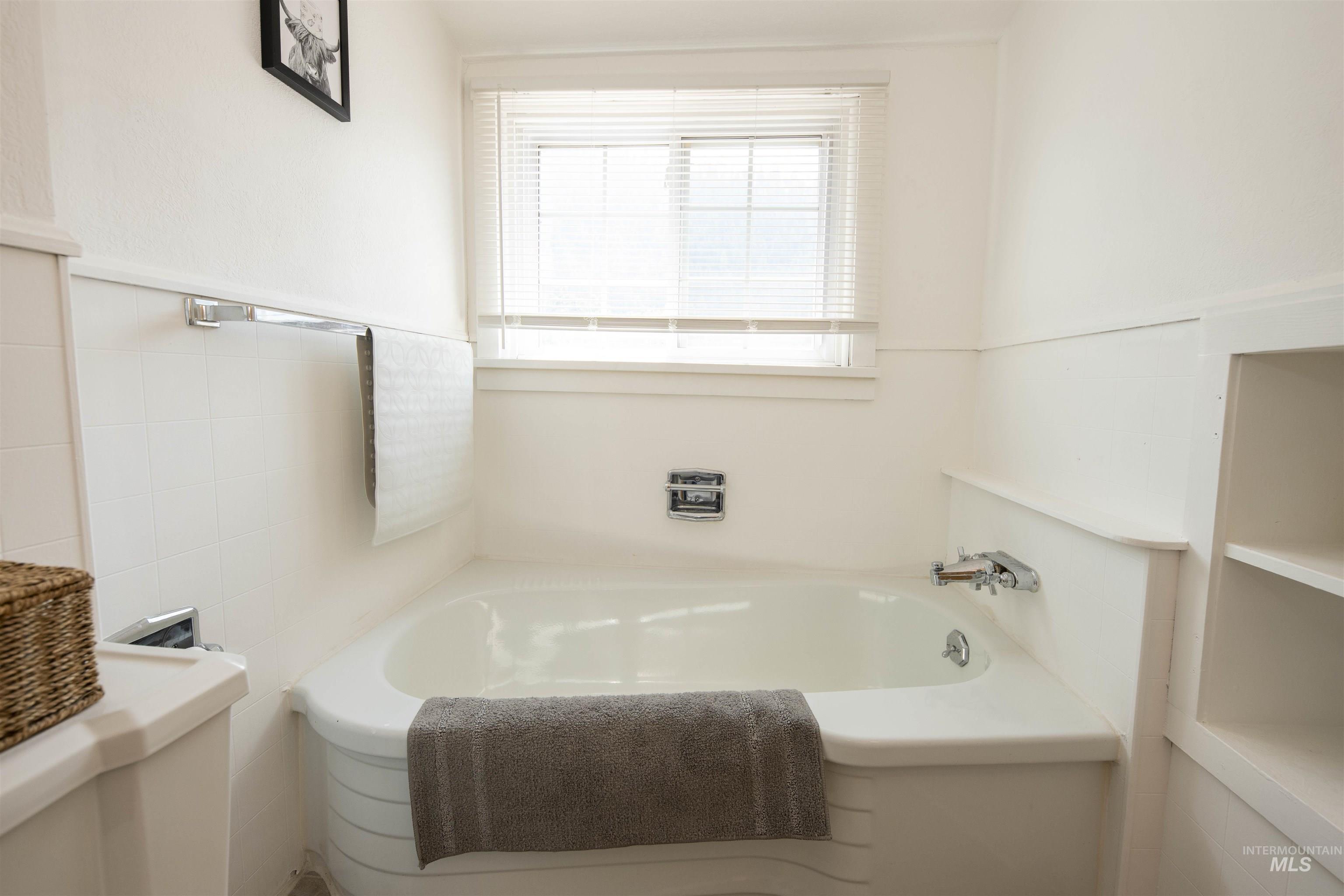 Full bathroom with a bath