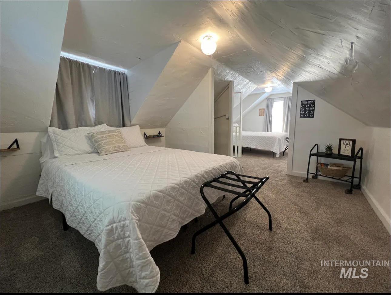 2nd home / AirBNB - Bedroom featuring carpet and vaulted ceiling