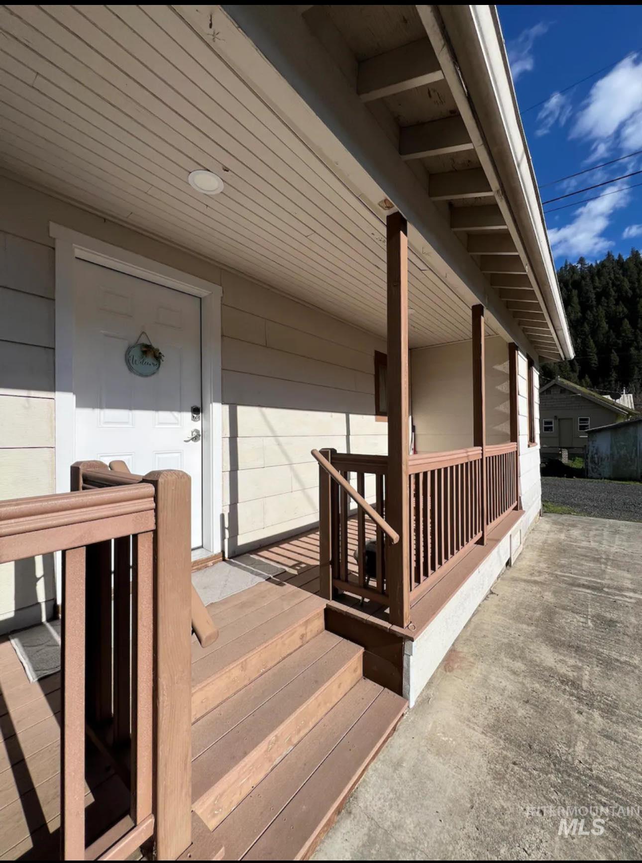 2nd home / AirBNB - View of exterior entry with a porch