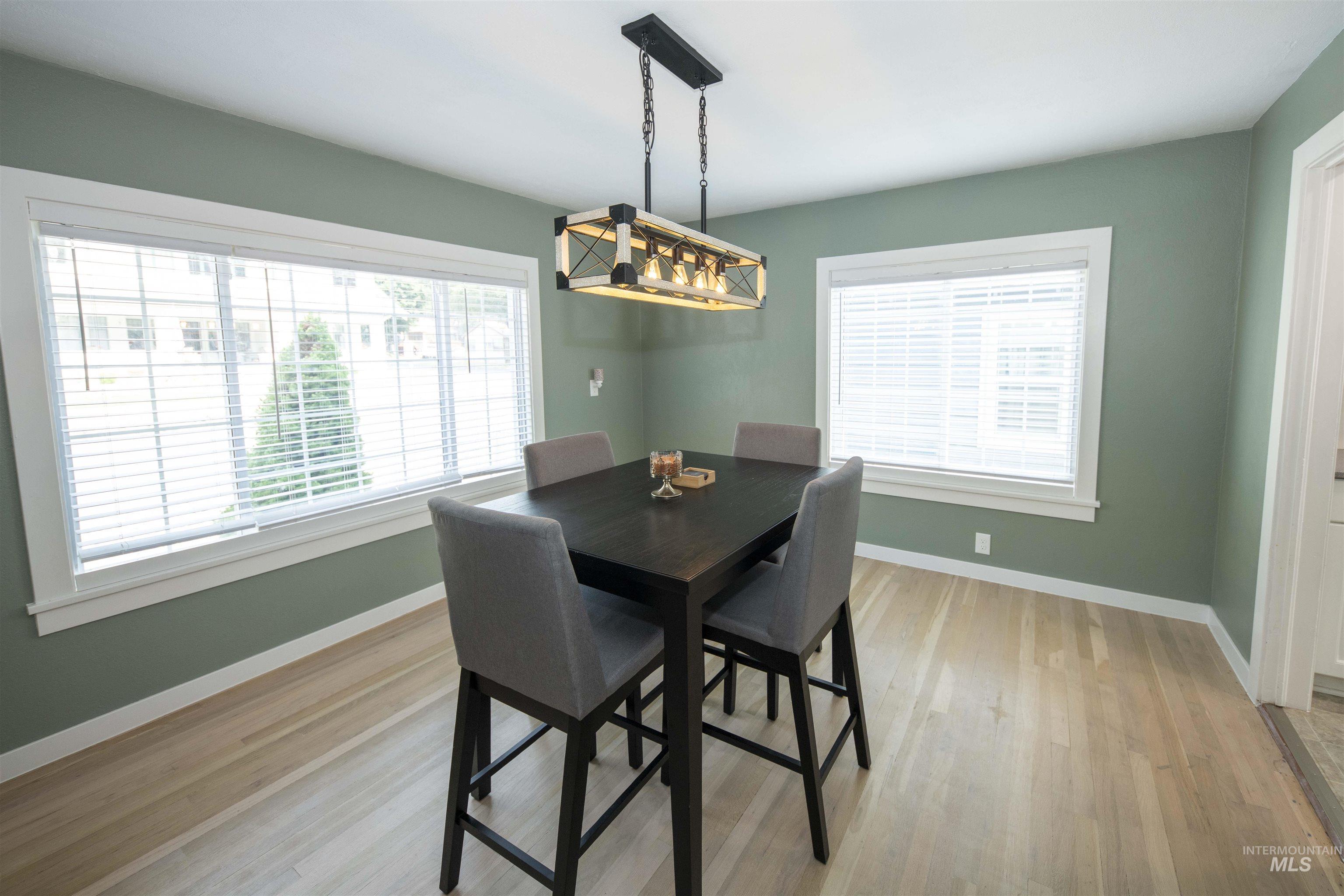Dining area featuring baseboards and light wood finished floors