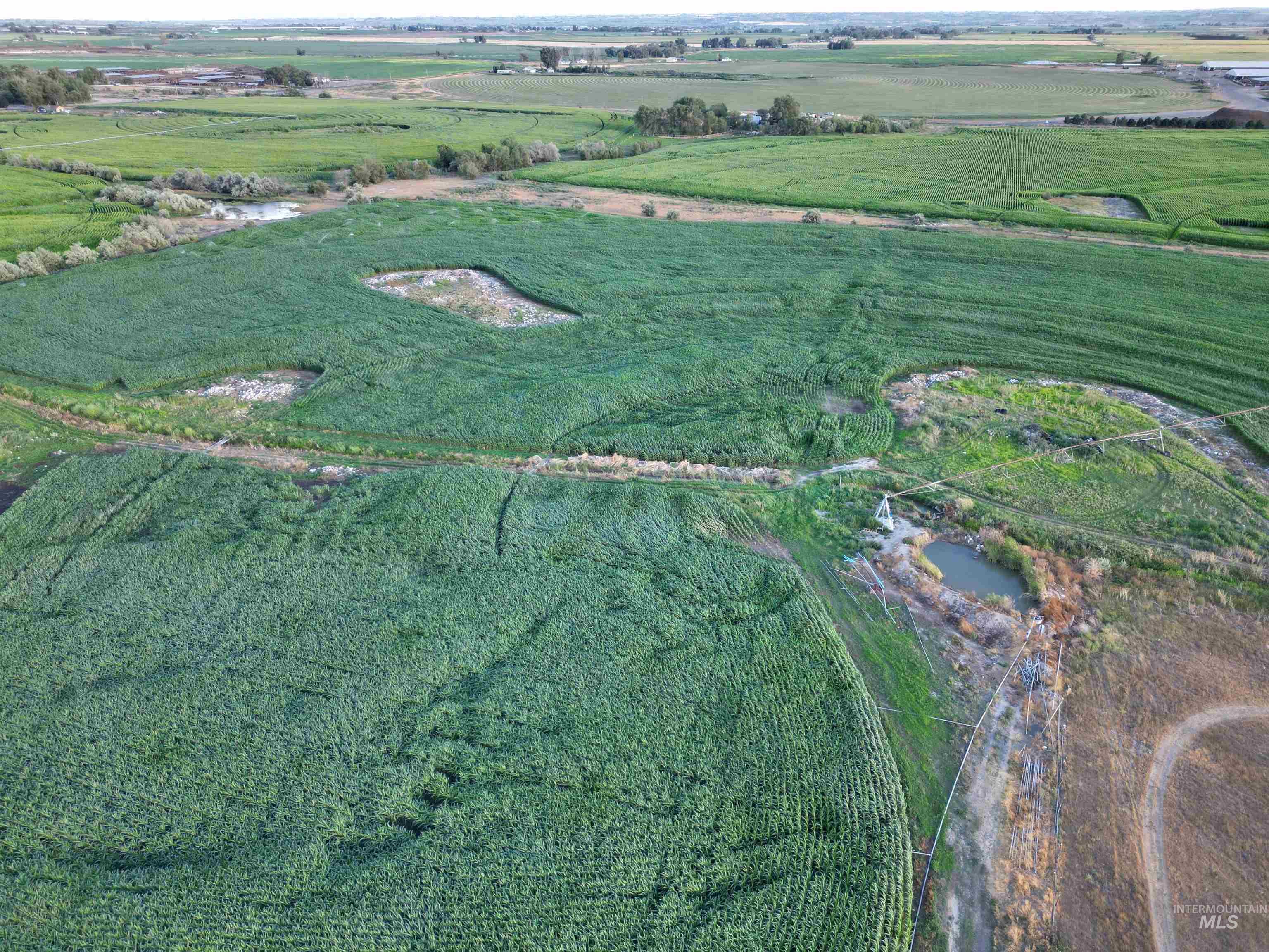 Aerial view of property and surrounding area featuring rural landscape