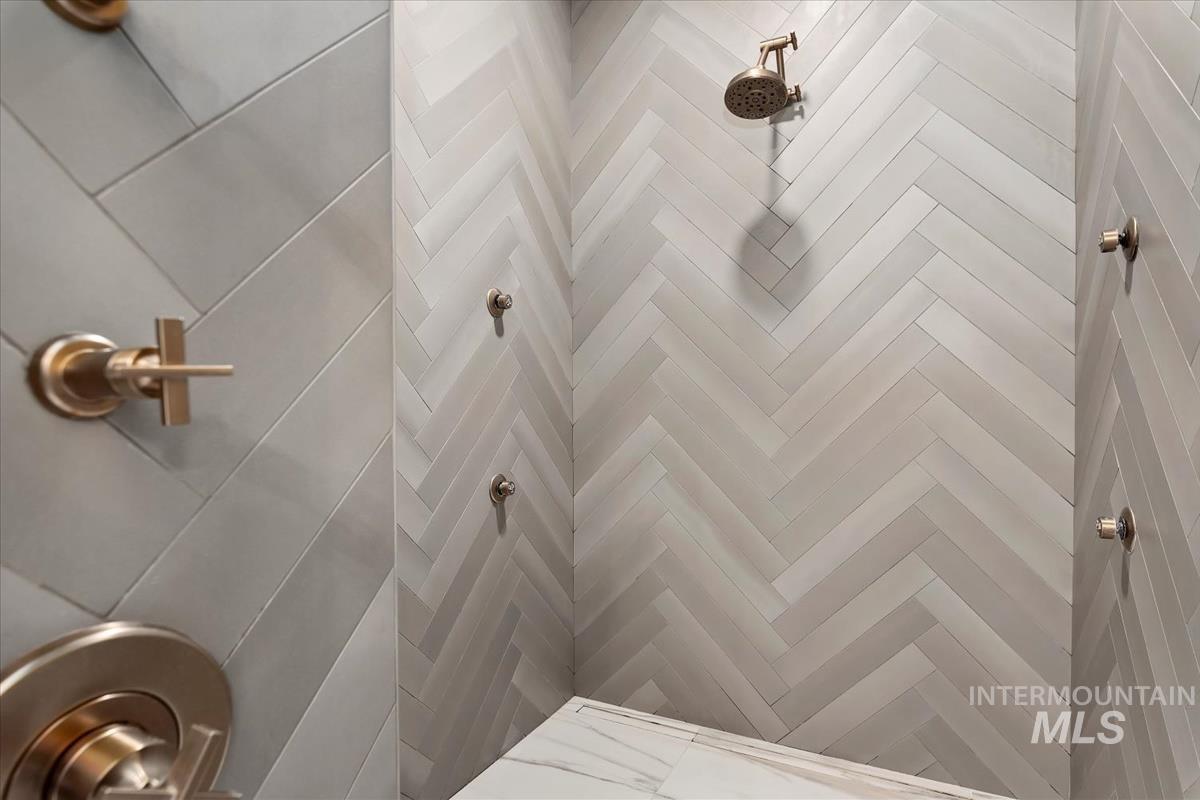 Bathroom view of a tile shower