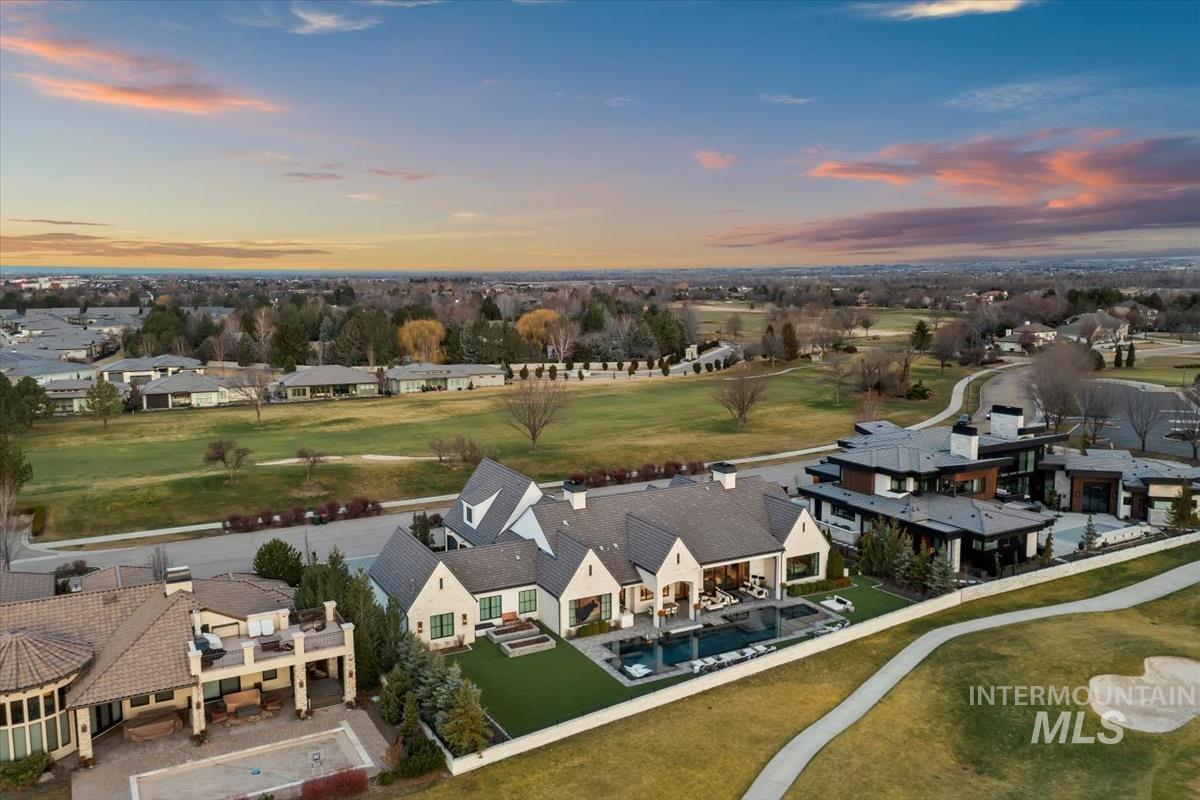Aerial view of residential area featuring a golf course