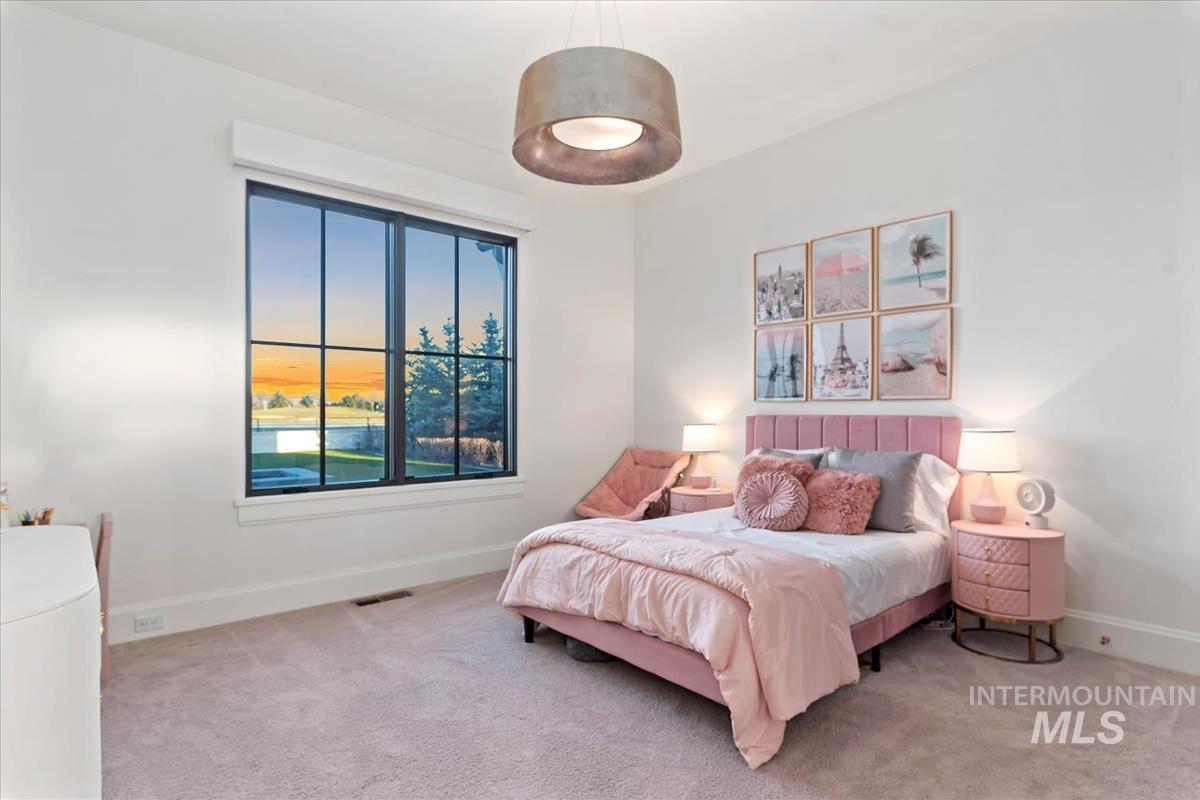 Carpeted bedroom with baseboards