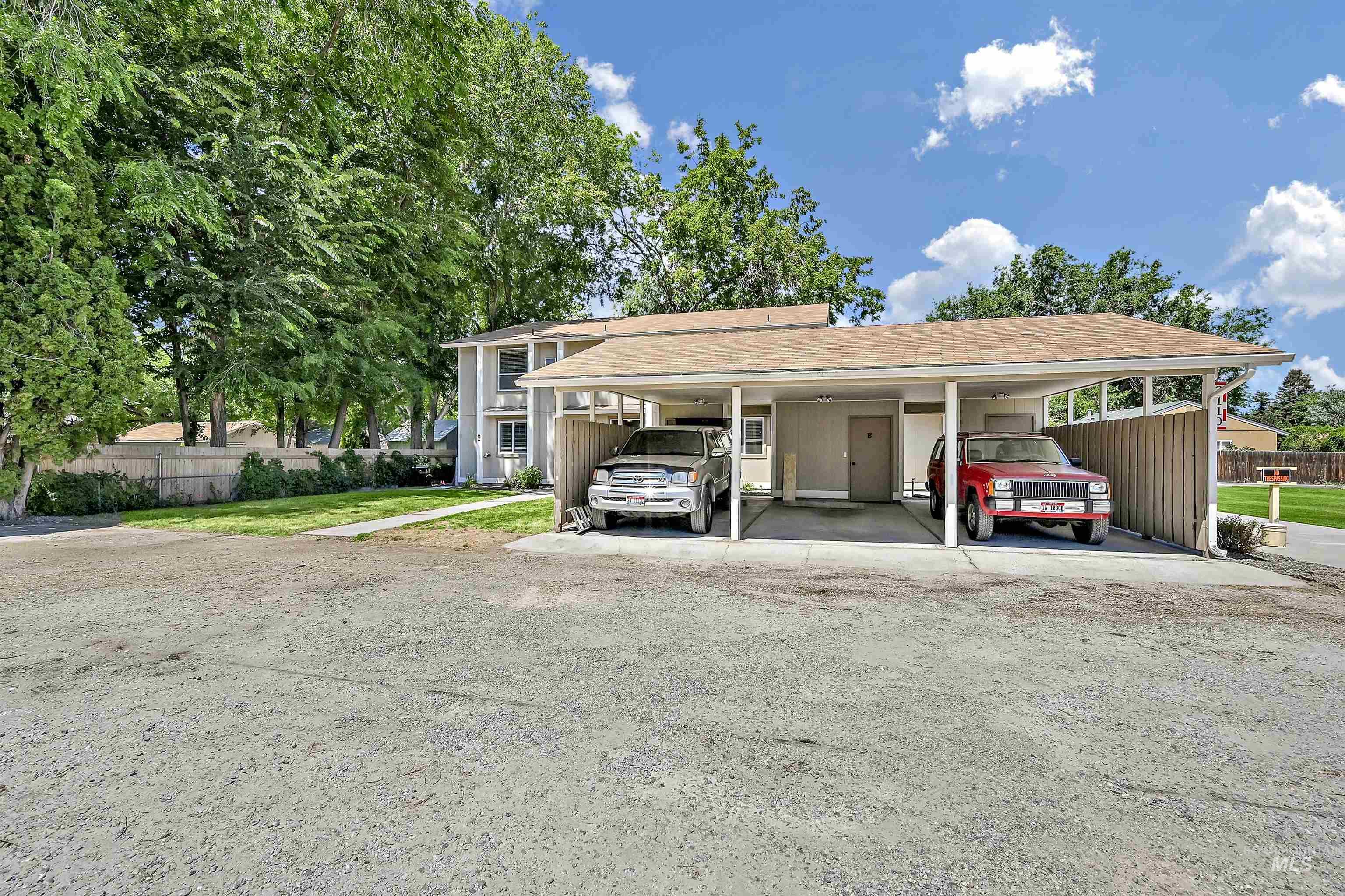 3 Car carport, one port per unit along with a storage closet for each. 3 additional uncovered parking spaces at the left side of the picture, 1 space per unit.