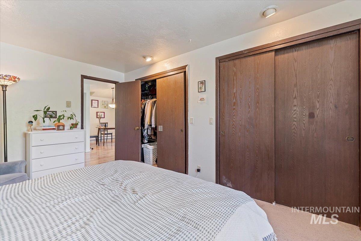 Bedroom with two closets and carpet floors