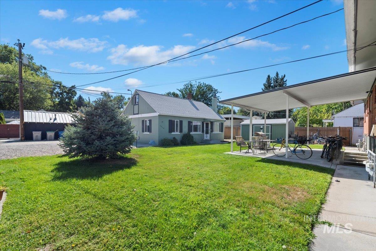 View of yard featuring an outbuilding and a patio