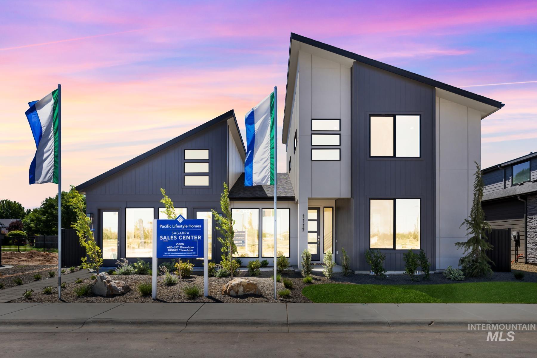 View of property at dusk