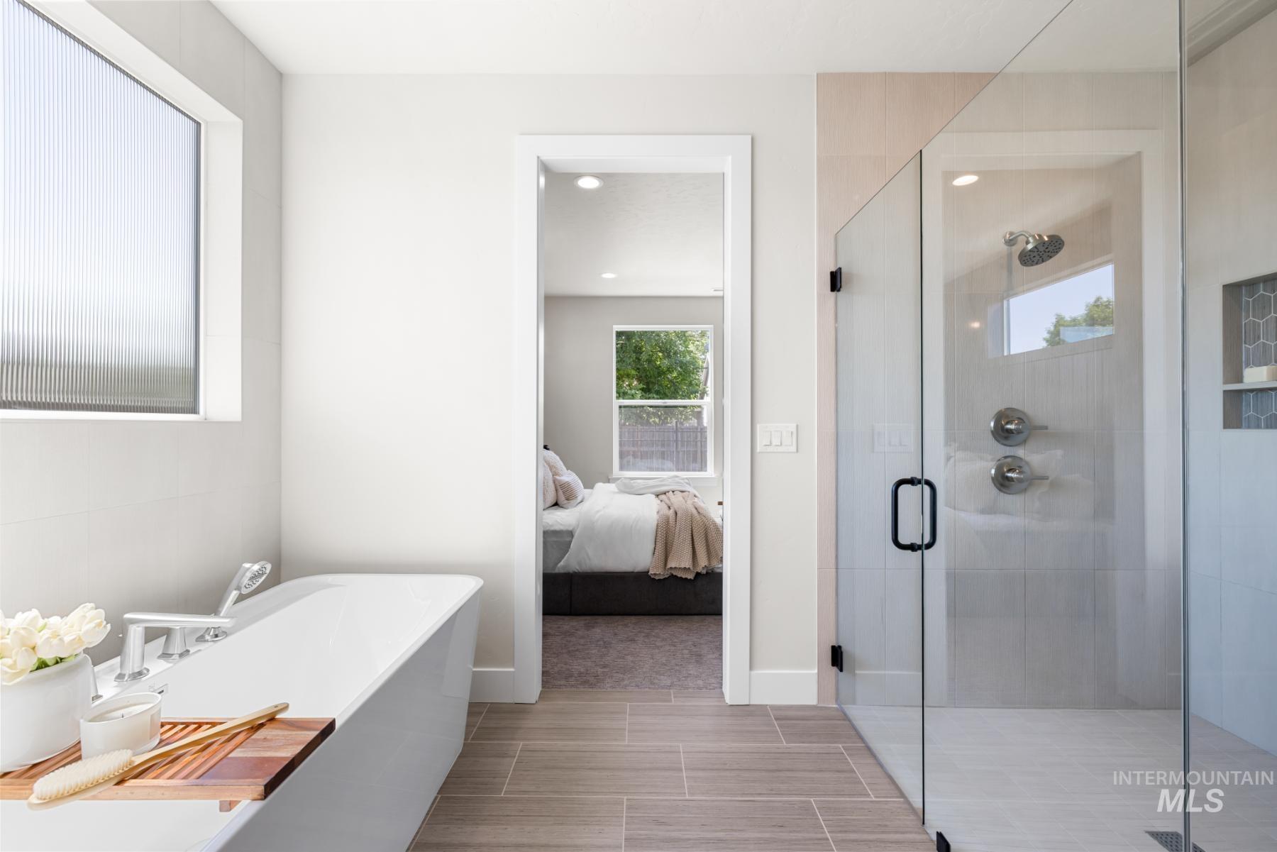 Ensuite bathroom with a soaking tub and a shower stall