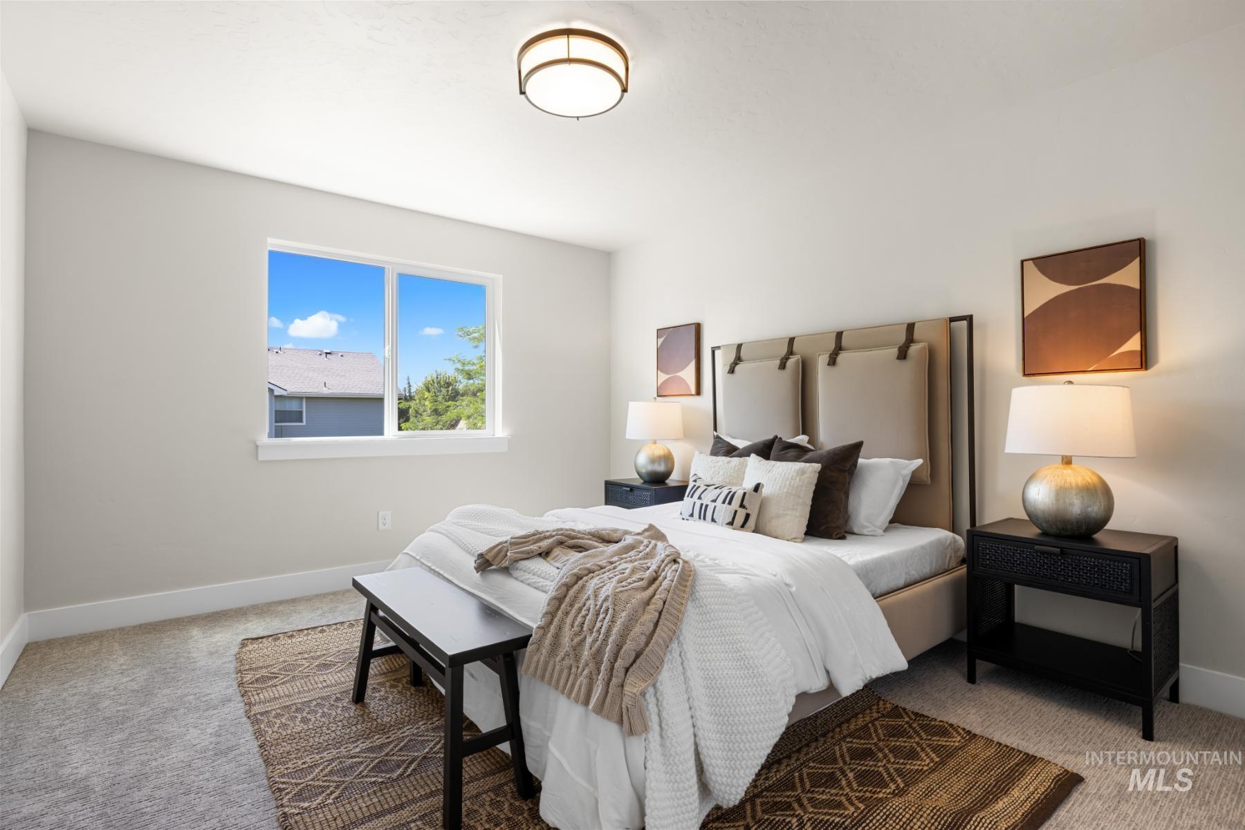 Bedroom with carpet floors and baseboards