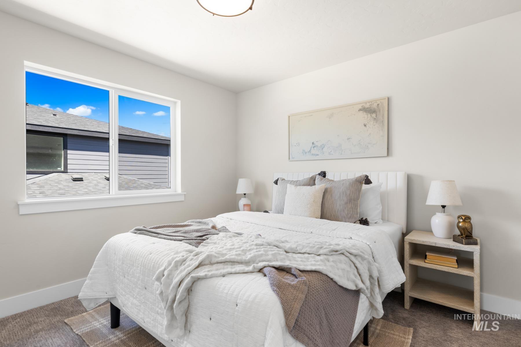 Carpeted bedroom with baseboards