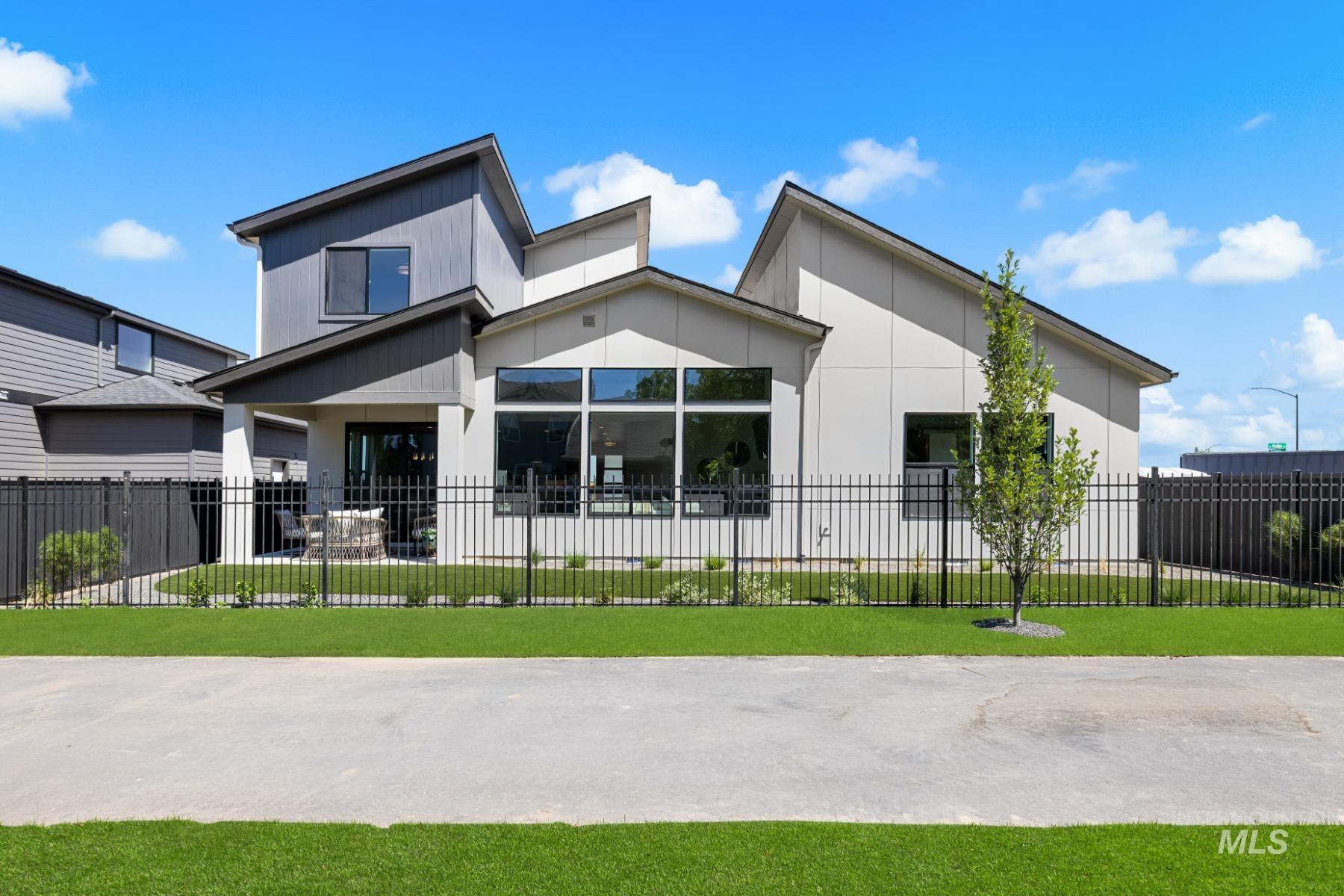 View of front of house featuring a fenced front yard