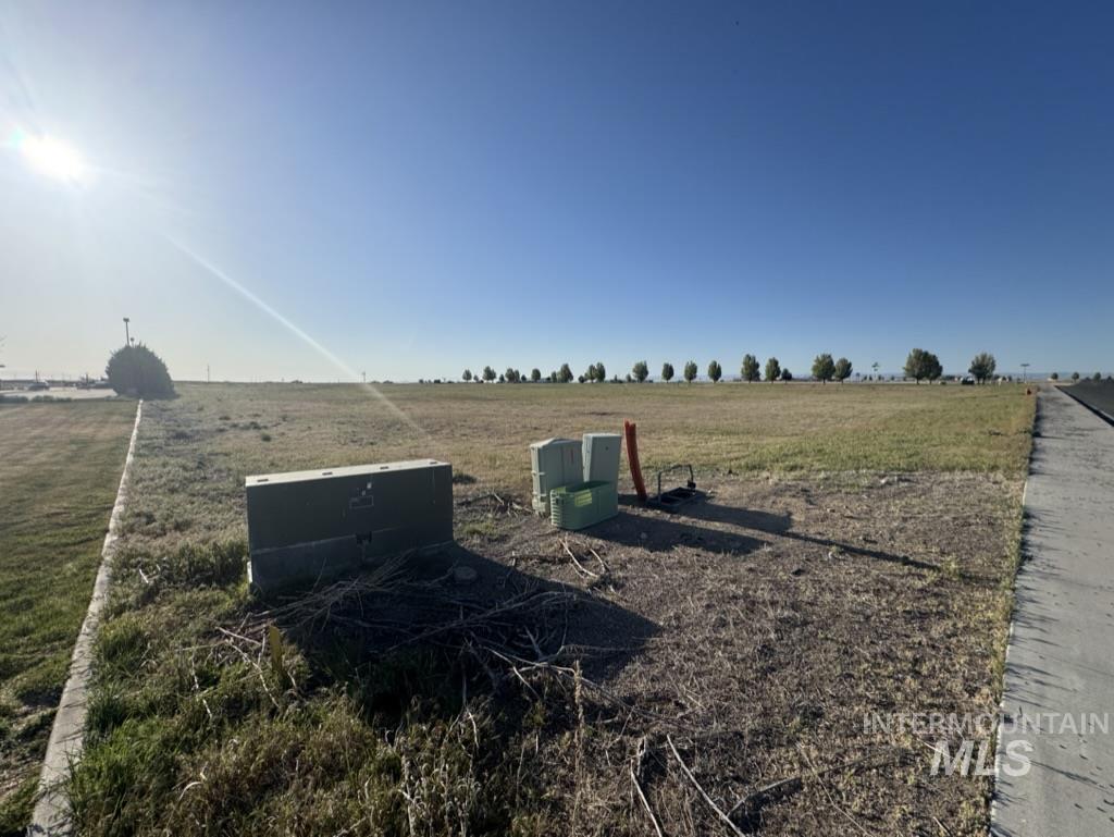 View of yard with a rural view