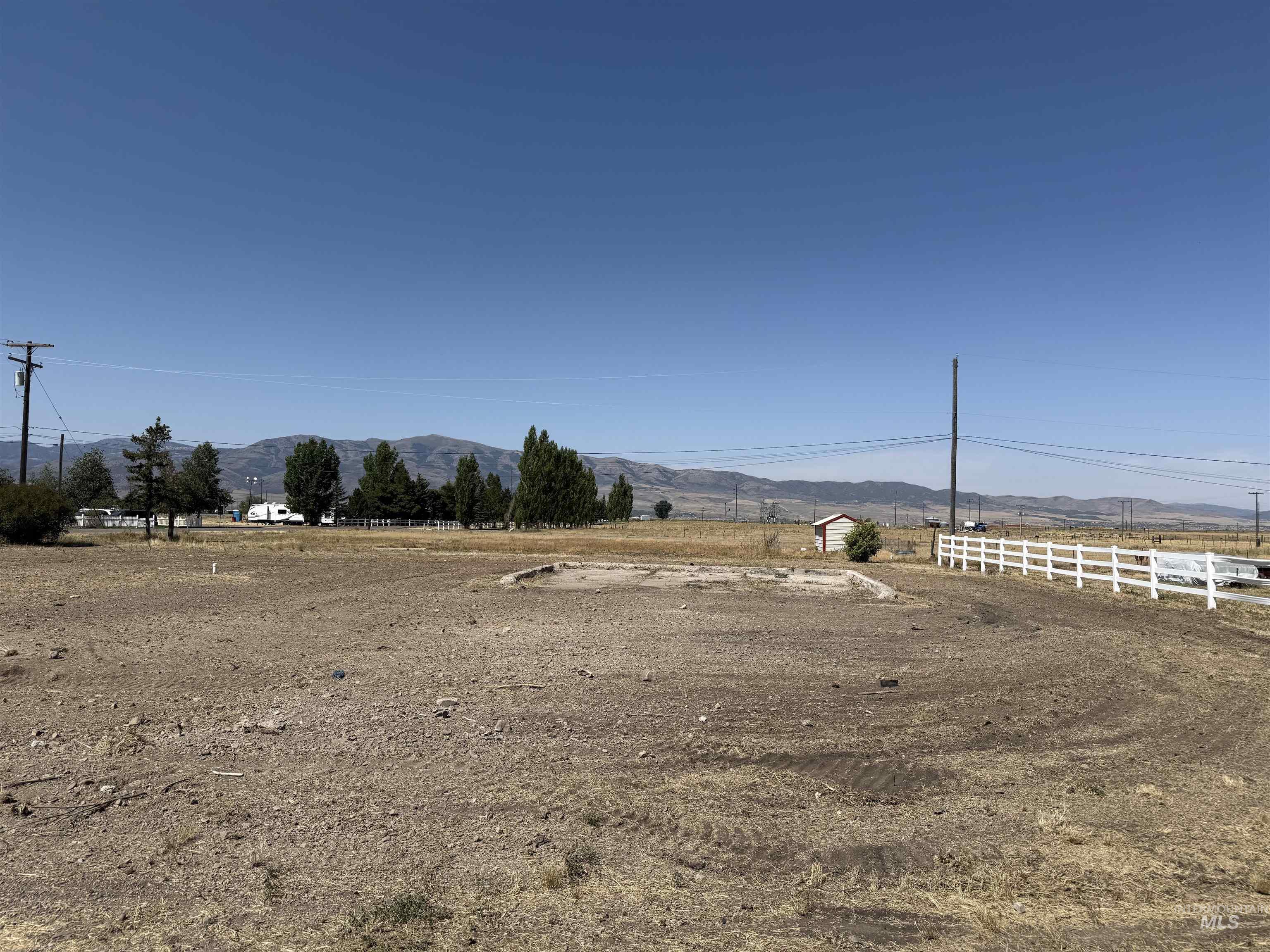 View of yard with a mountain view and a view of rural / pastoral area