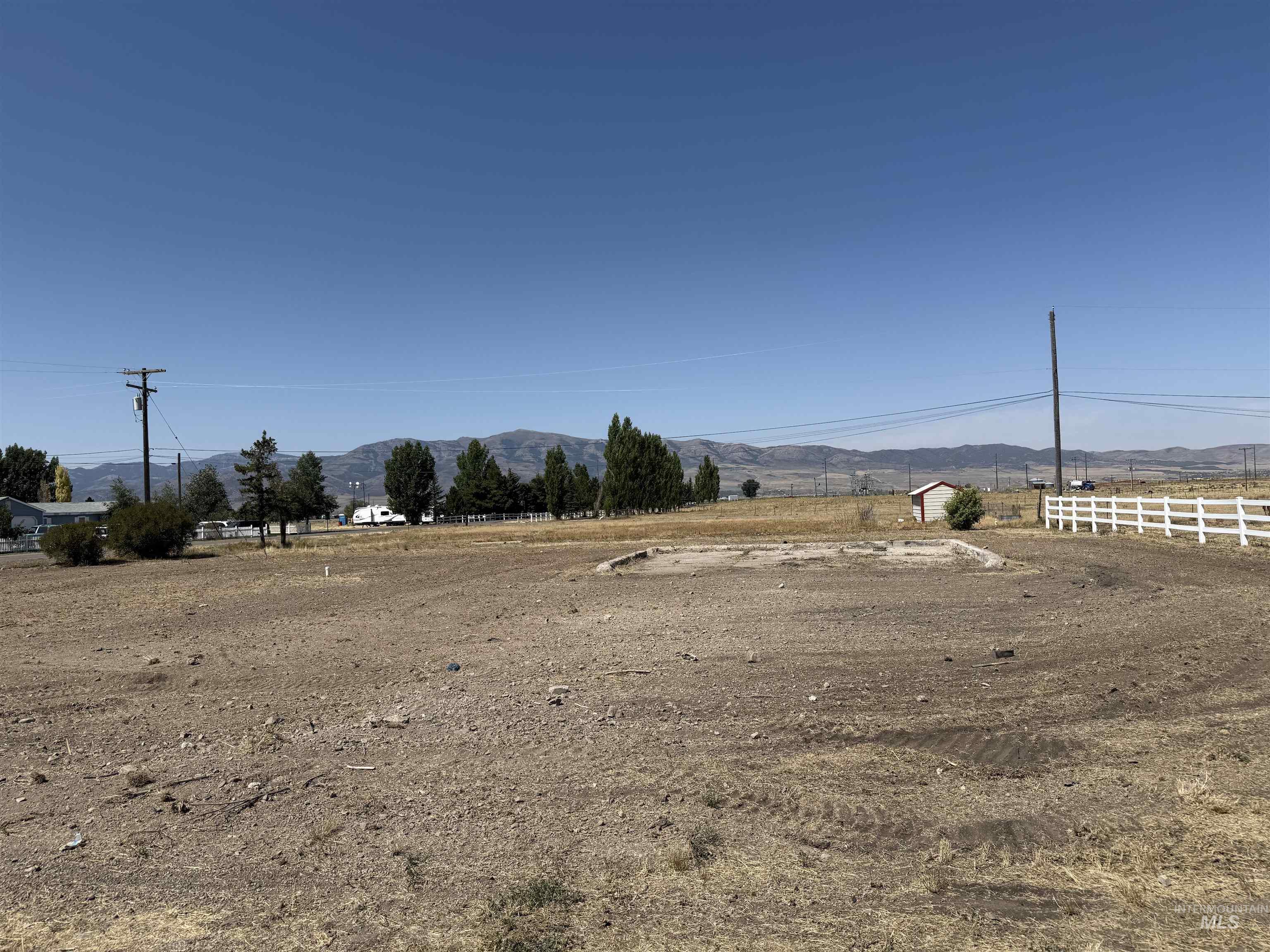 View of yard featuring a mountain view and a view of countryside