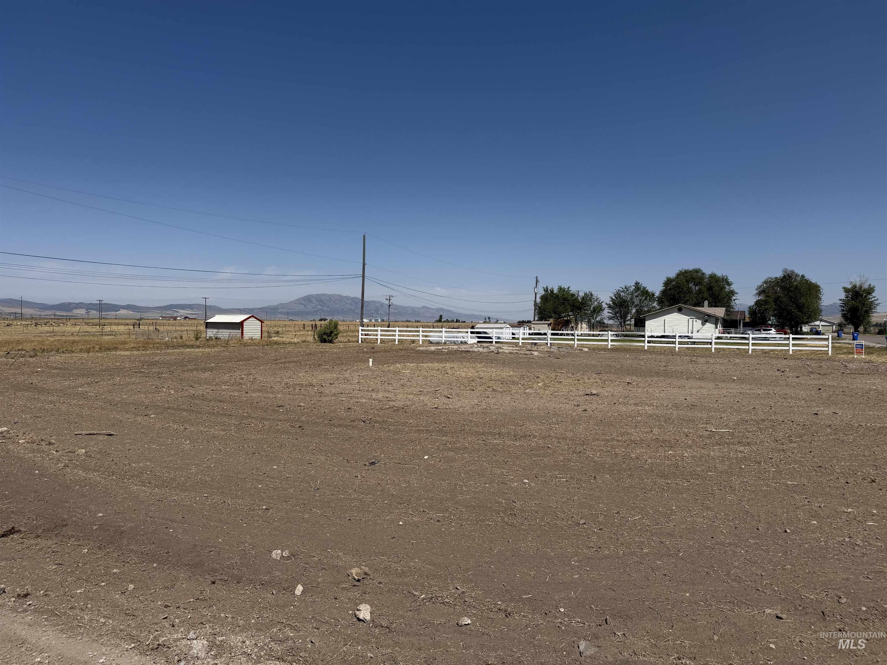 View of yard featuring a mountain view and a rural view