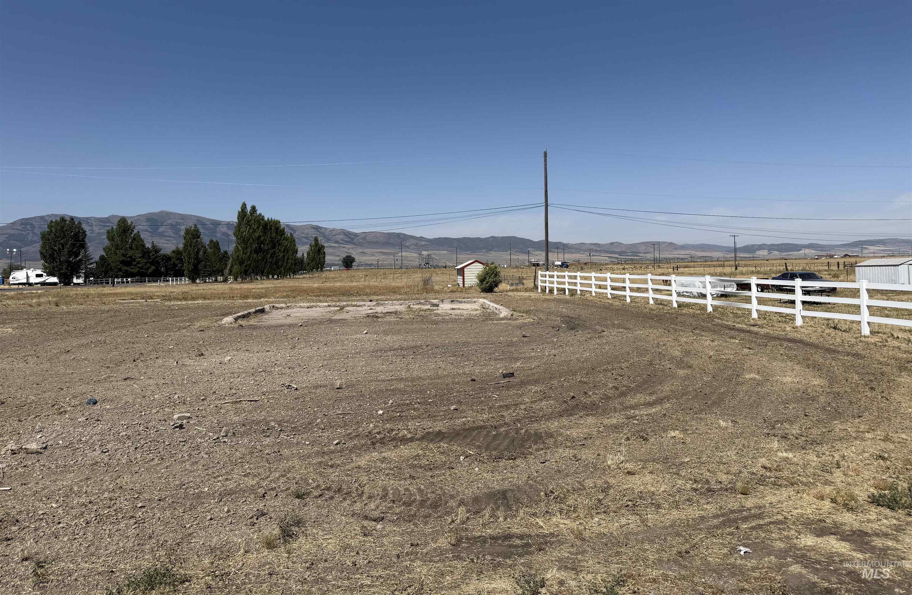 View of yard featuring a rural view and a mountain view