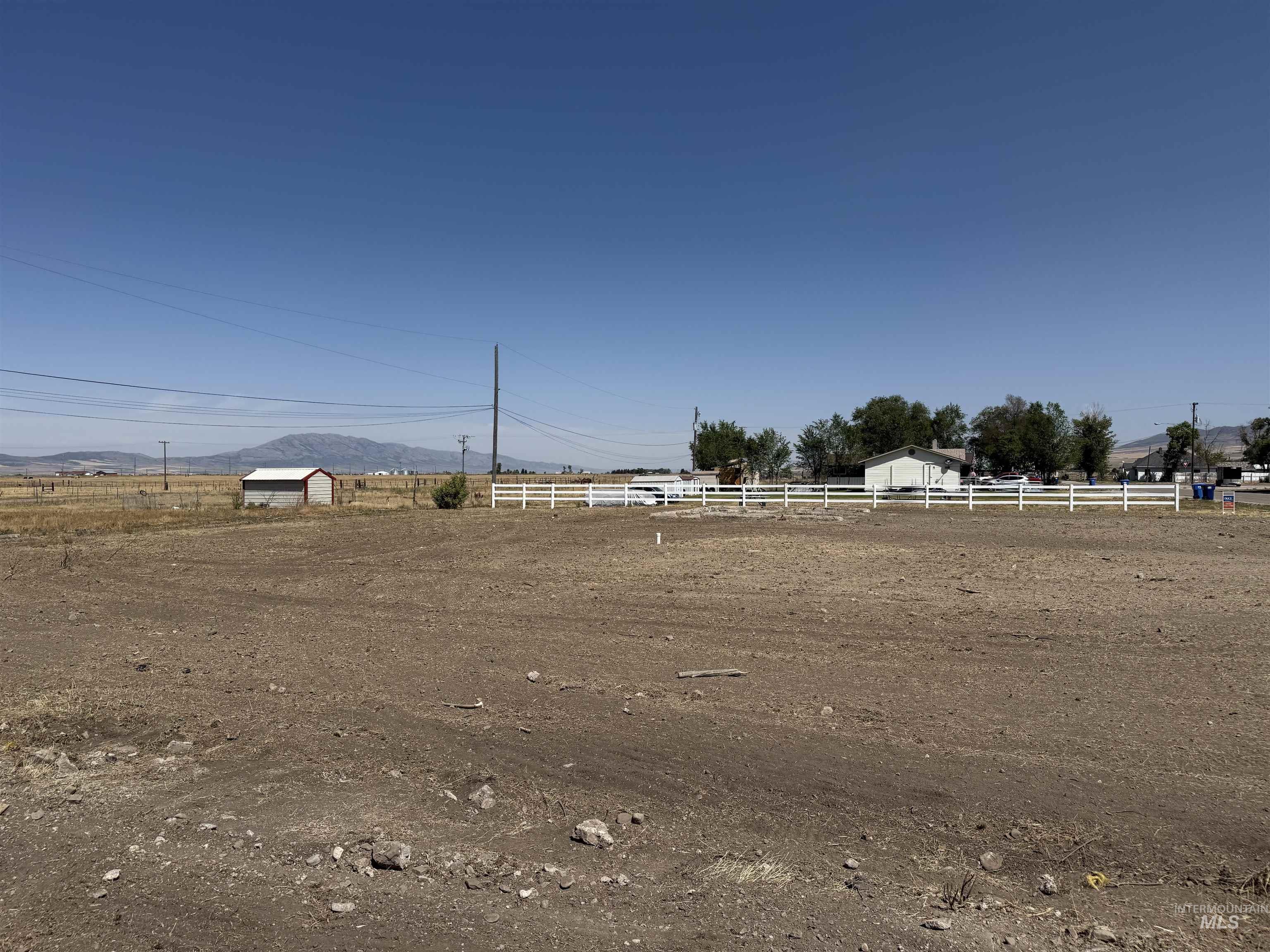 View of yard featuring an enclosed riding area, a view of countryside, and a mountain view