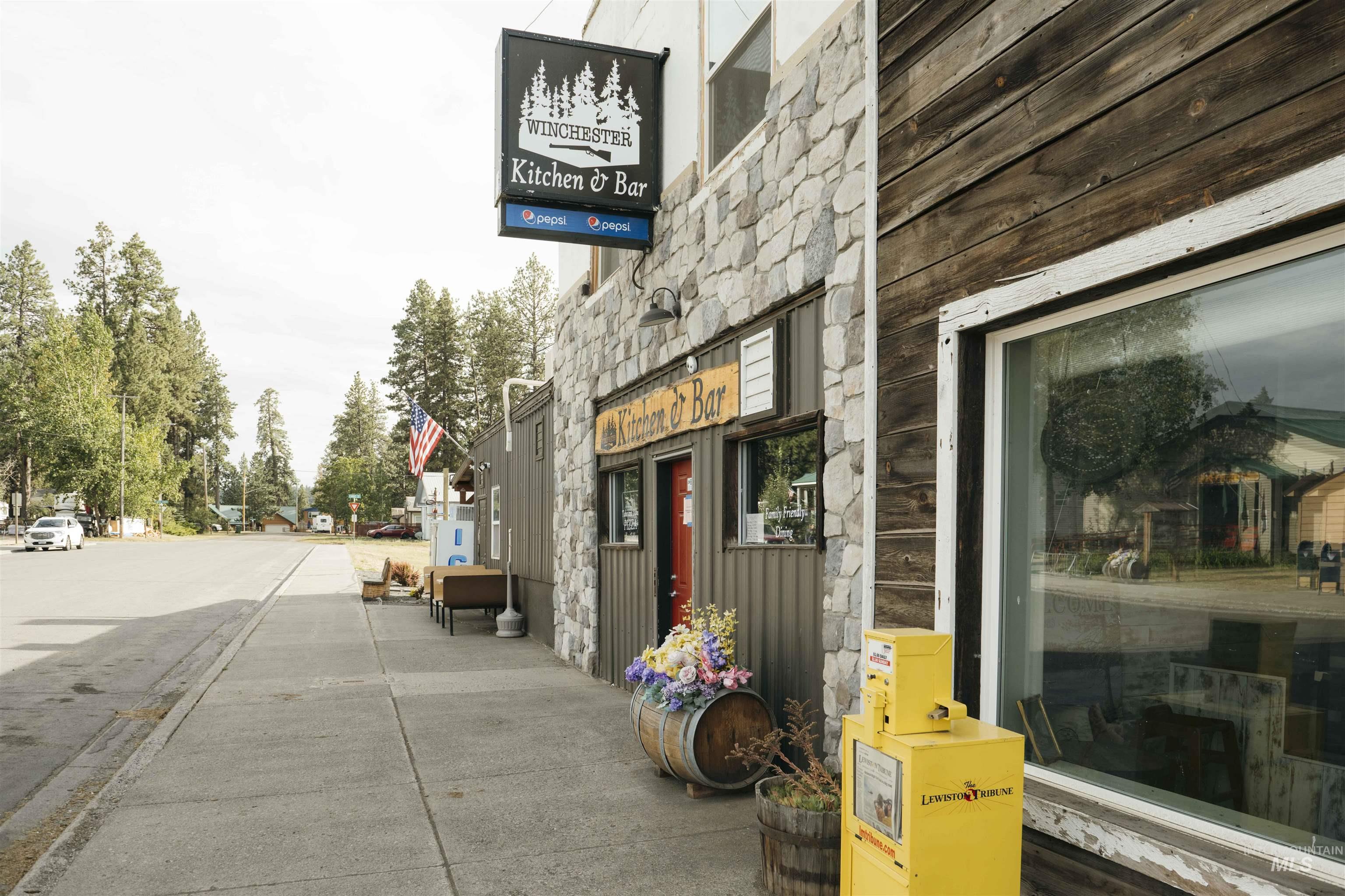Exterior space featuring stone siding