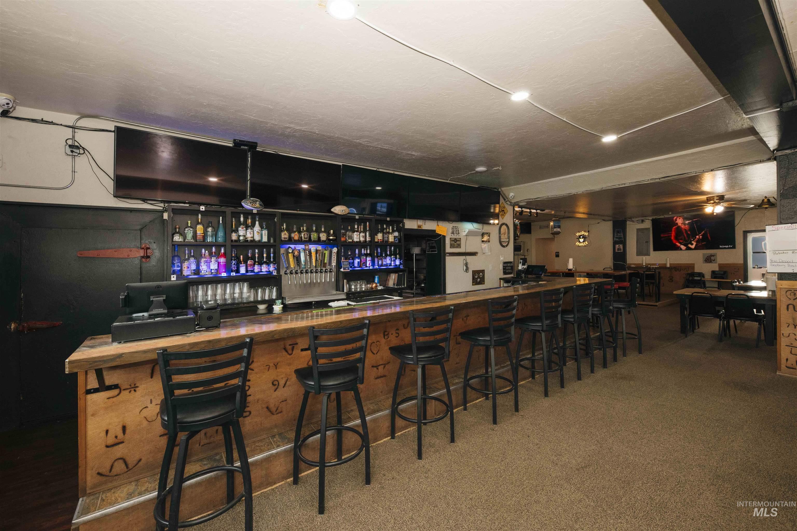 Community bar area featuring carpet floors