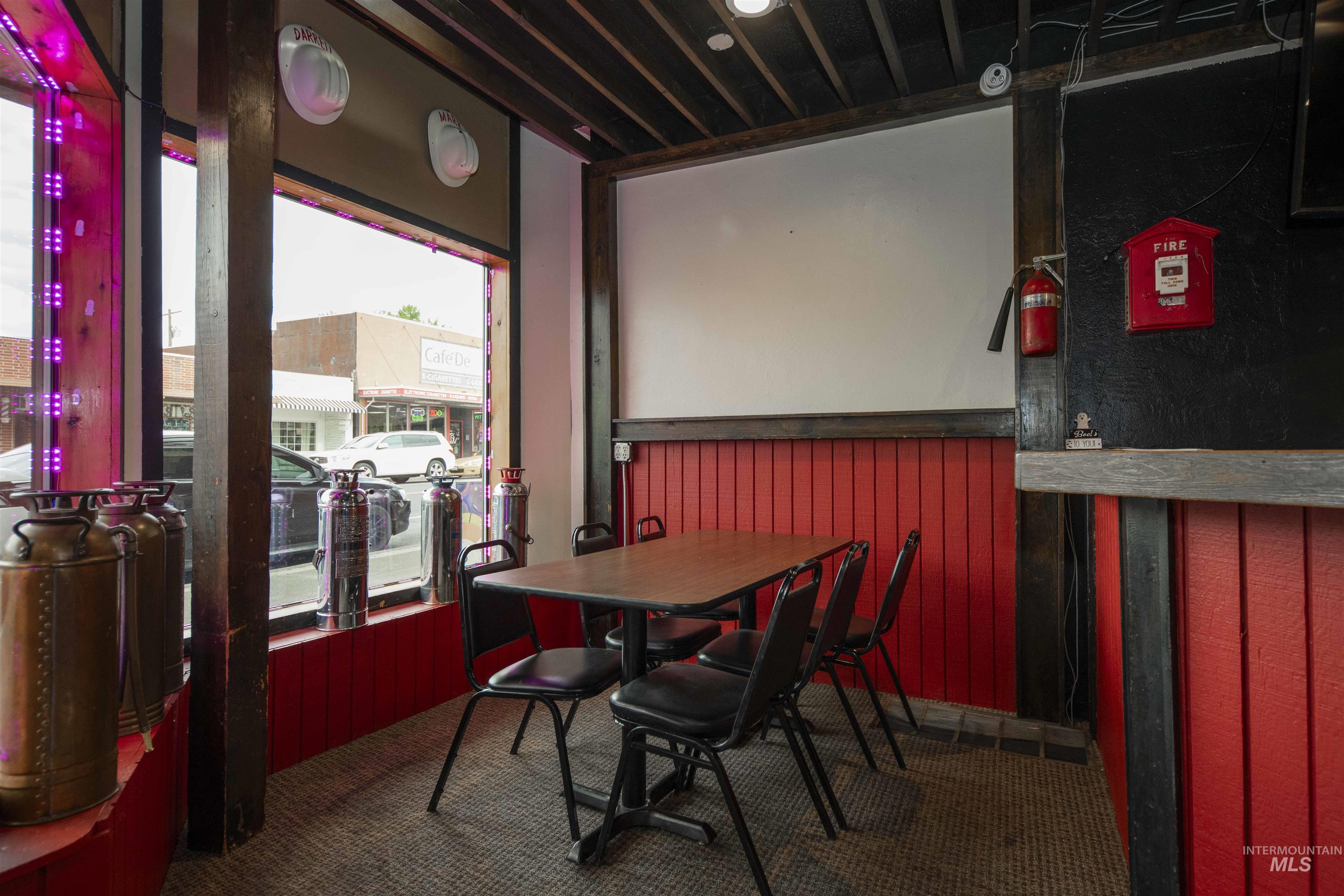 Dining space with wooden walls and wainscoting