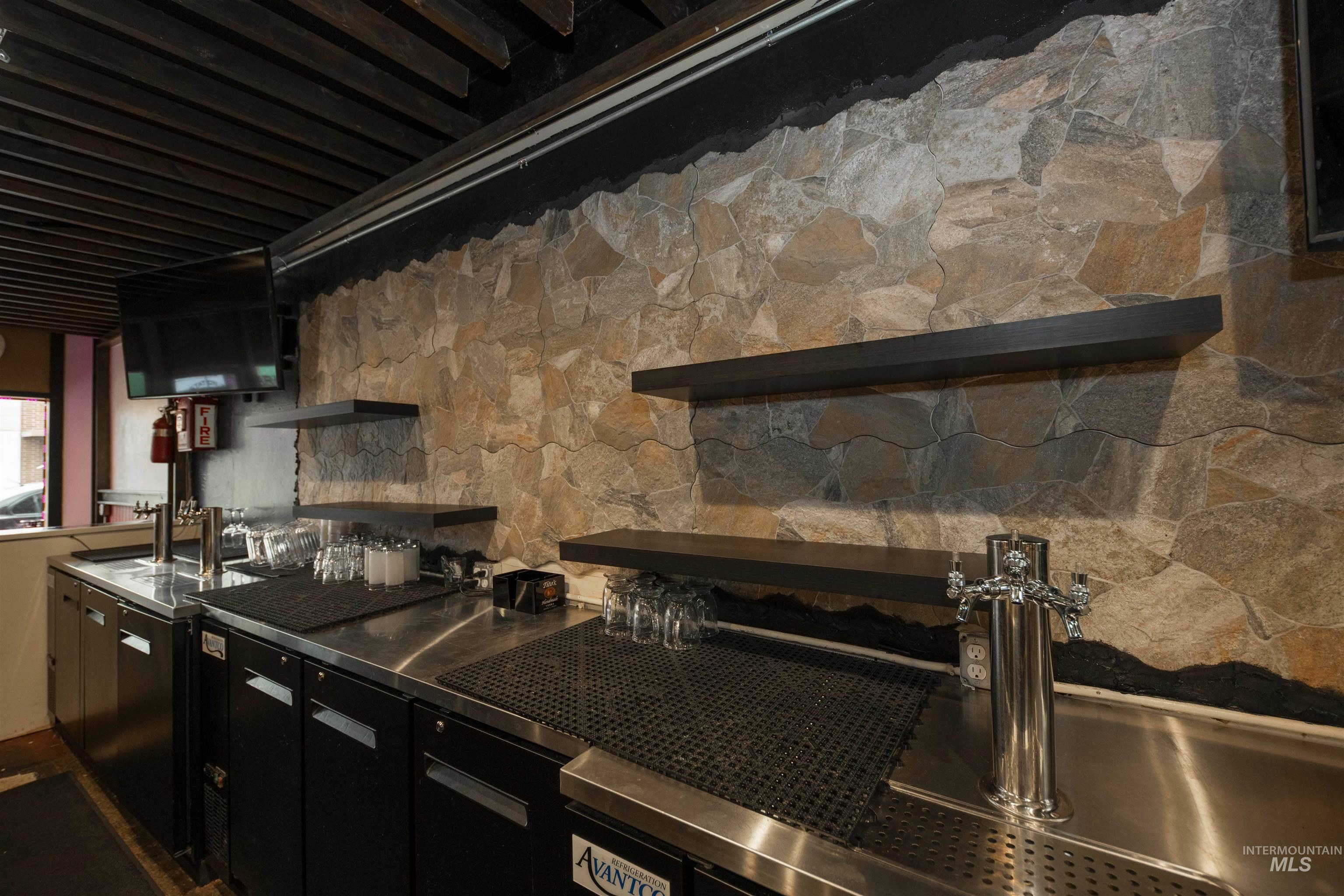 Kitchen featuring a sink and stainless steel counters