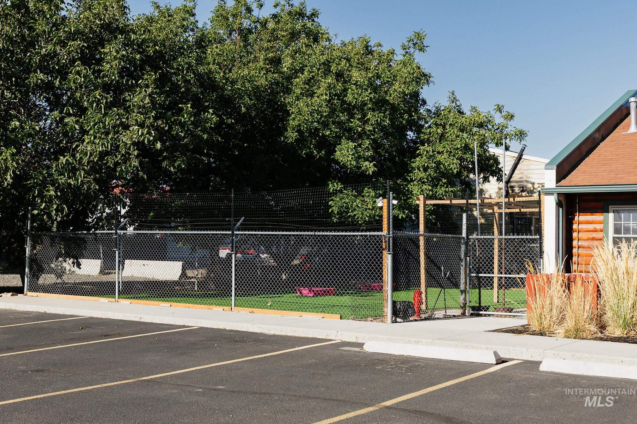Uncovered parking lot featuring a gate
