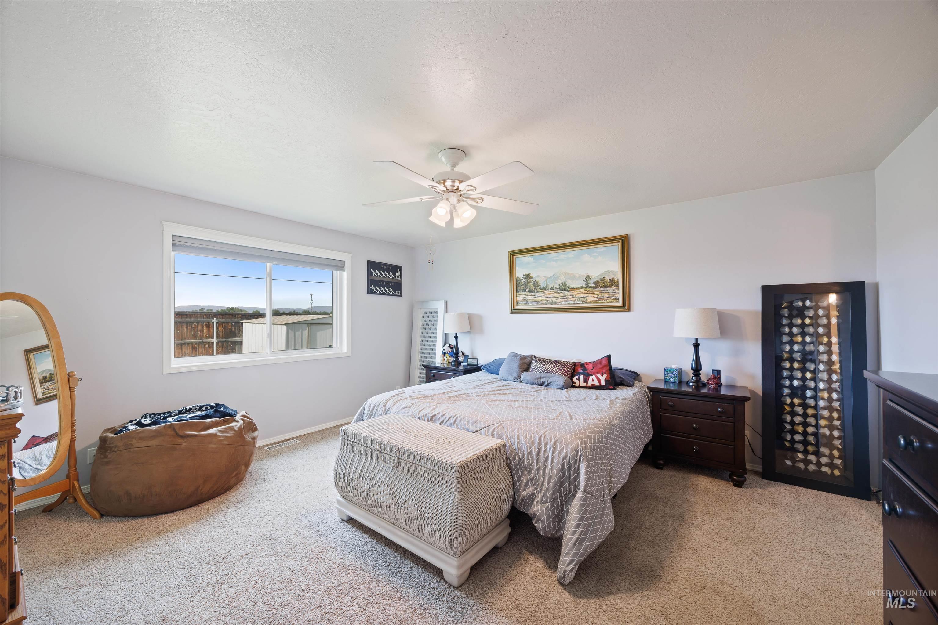 Bedroom with carpet flooring and ceiling fan