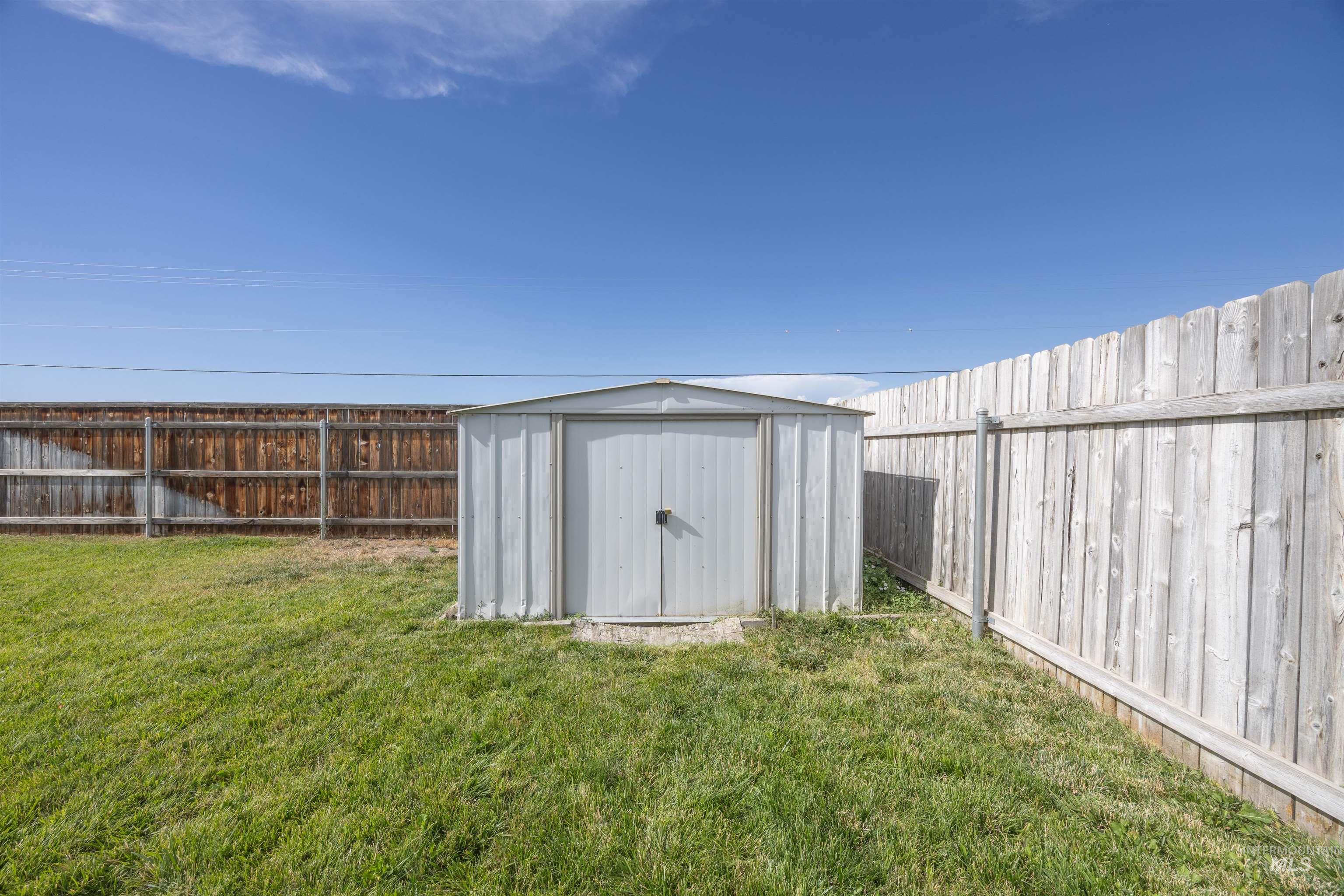 View of shed featuring a fenced backyard