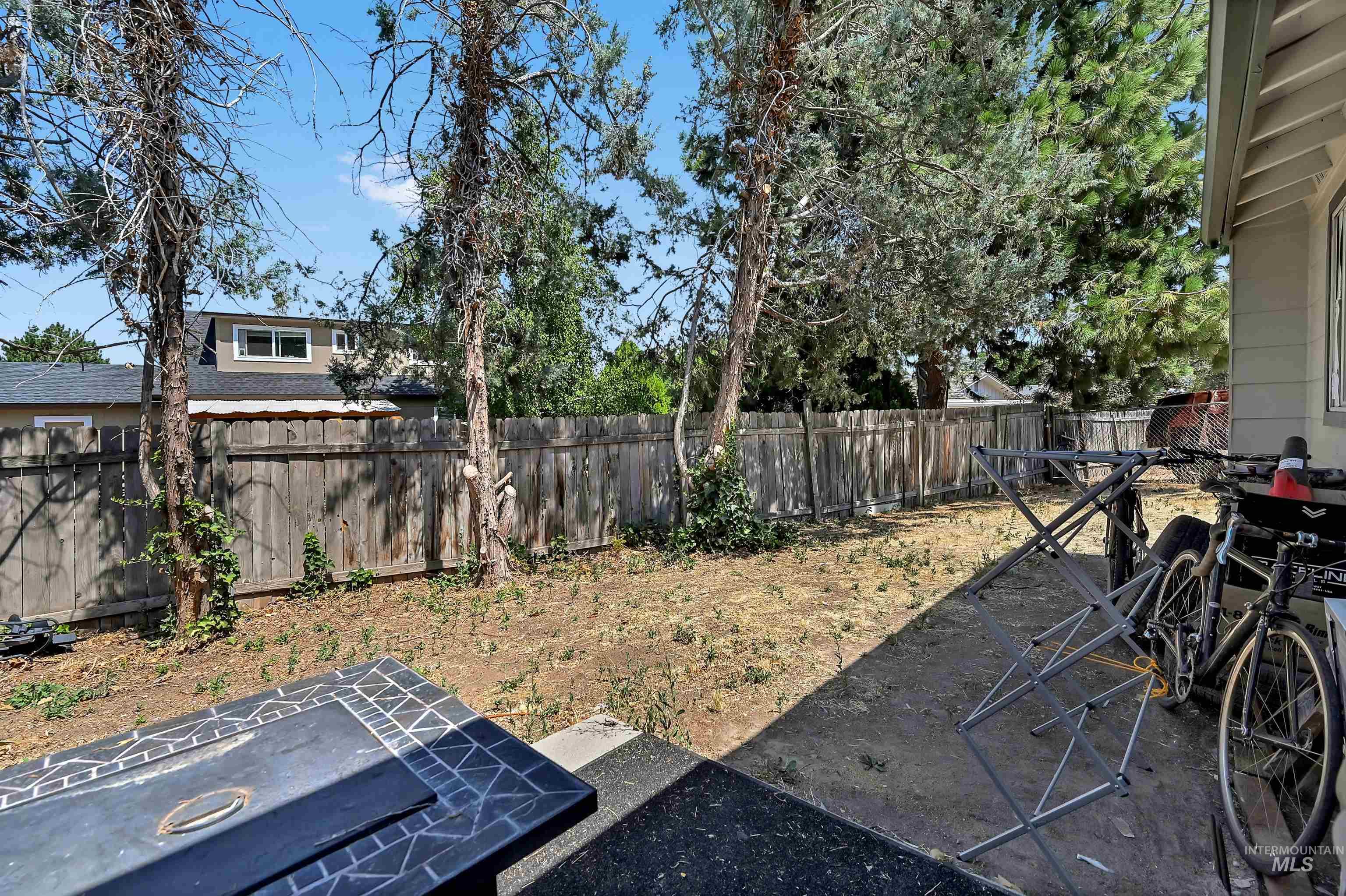 View of fenced backyard, room for possible expansion