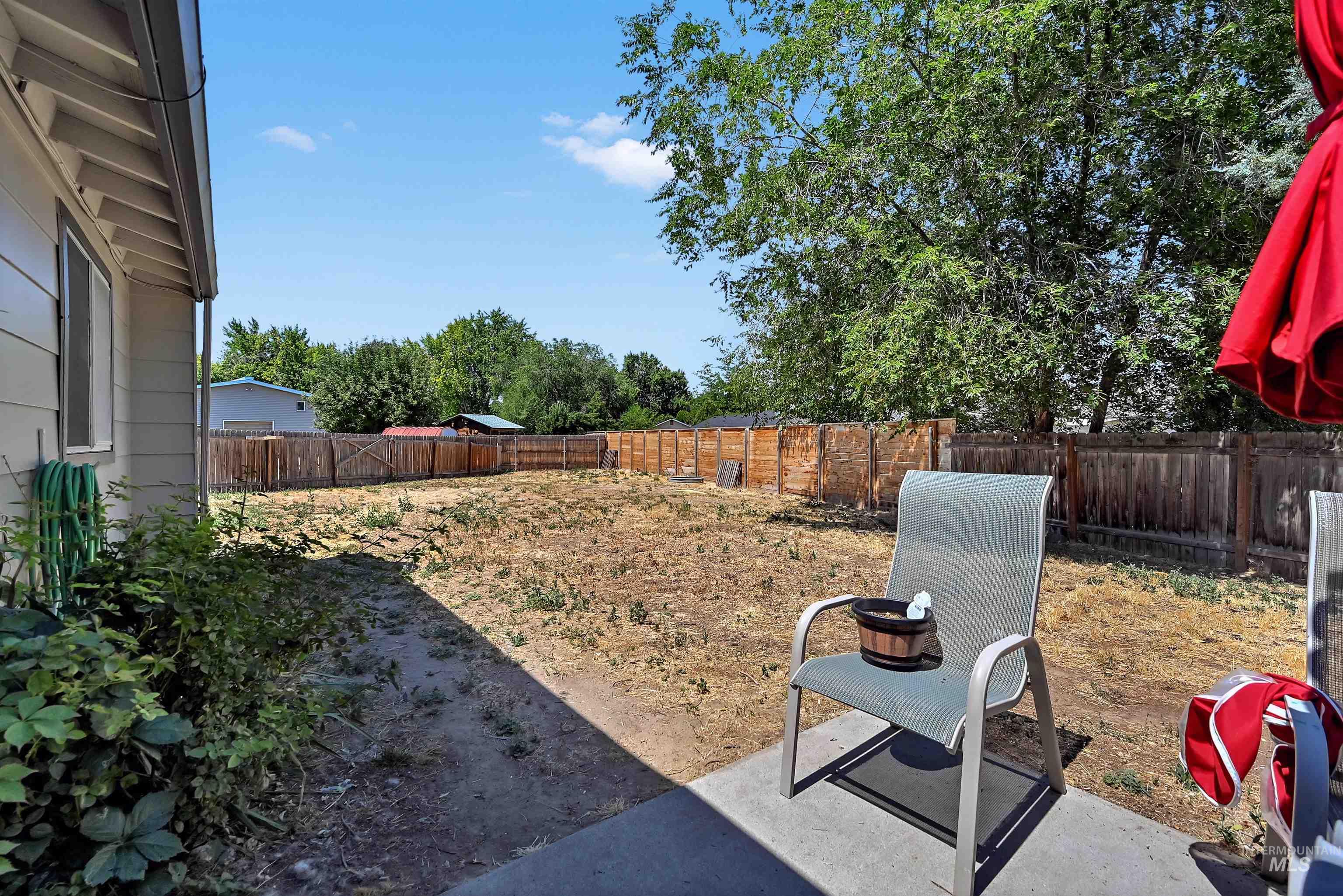 View of fenced backyard