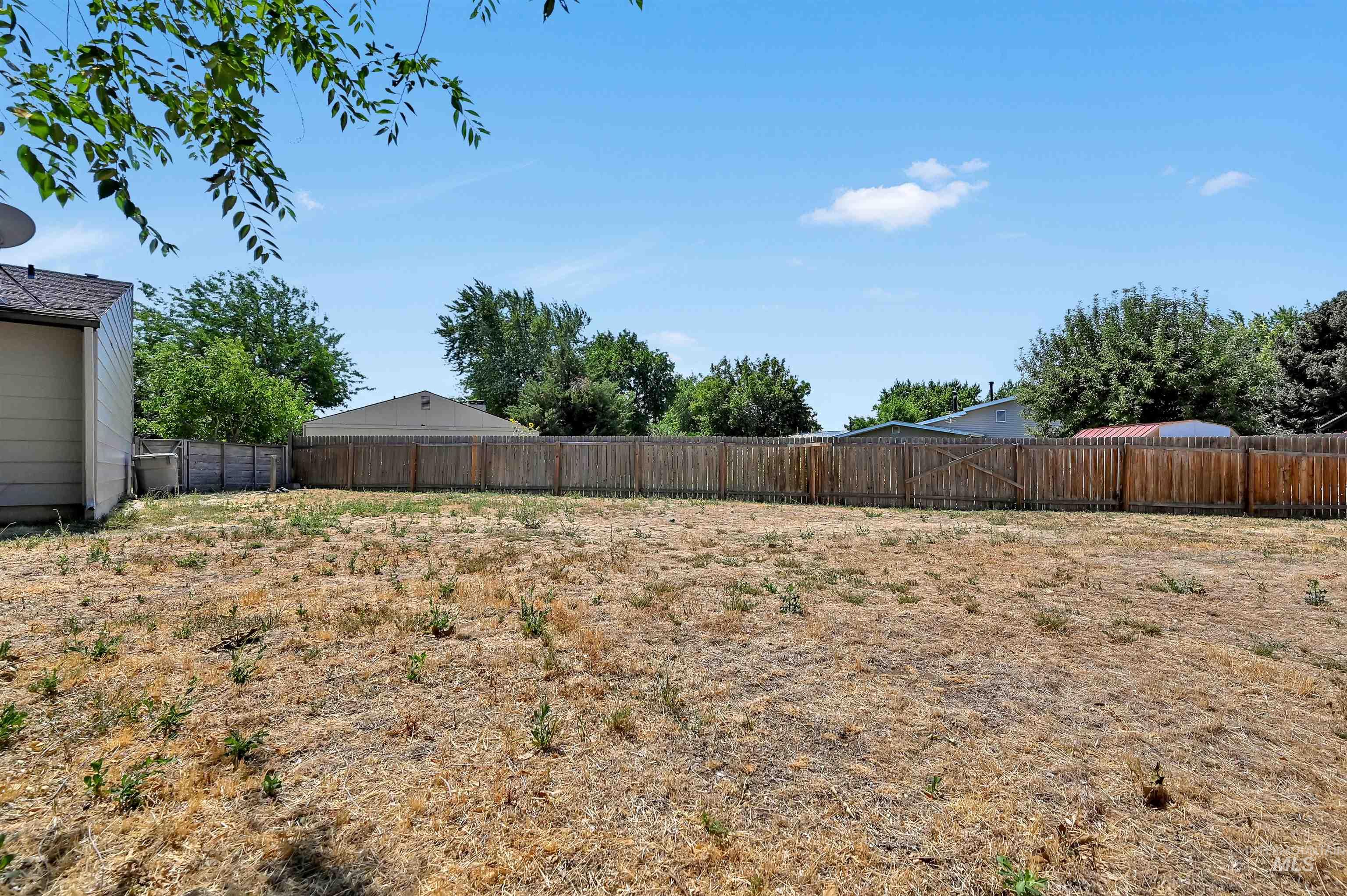 View of fenced backyard