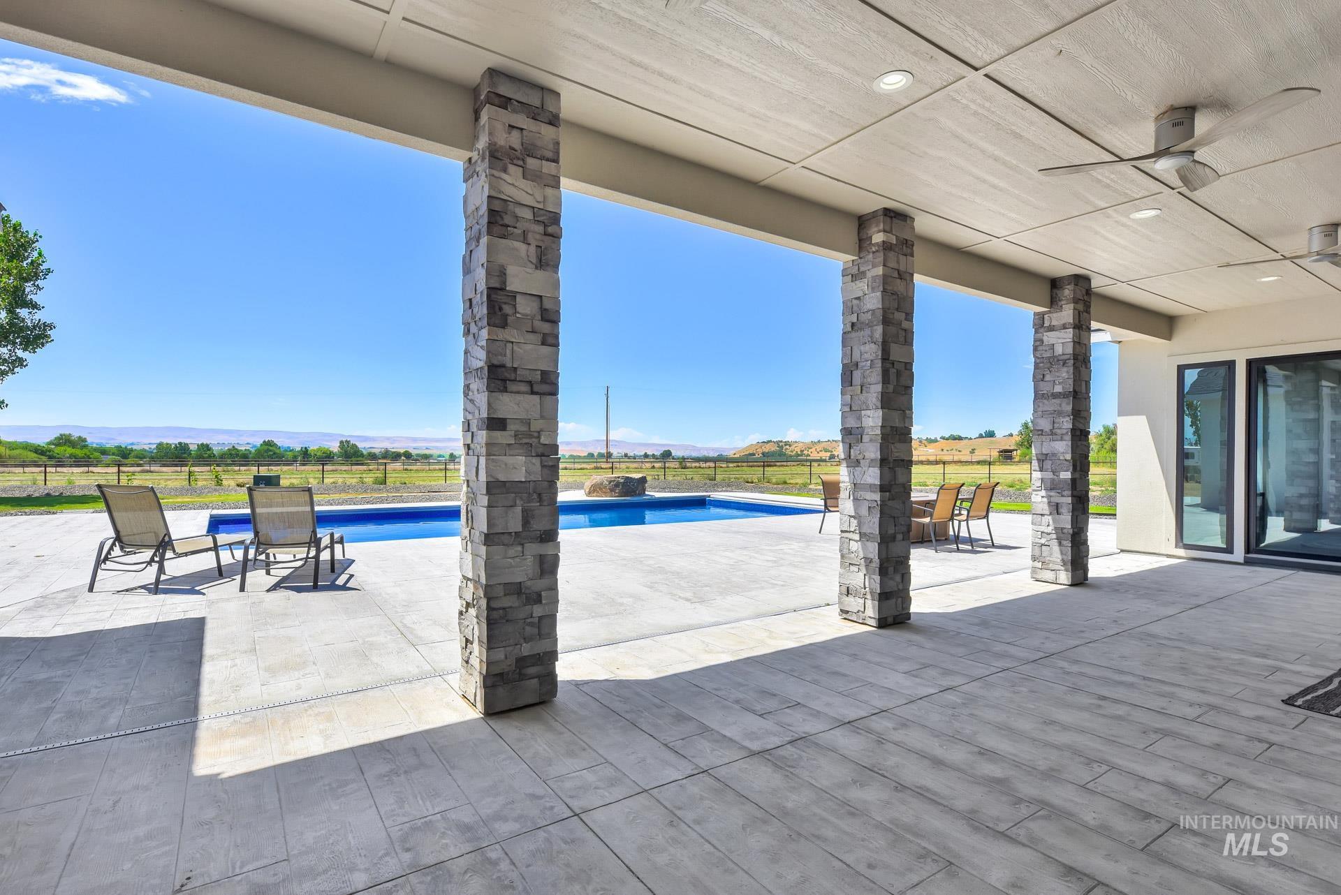 View of patio featuring a ceiling fan