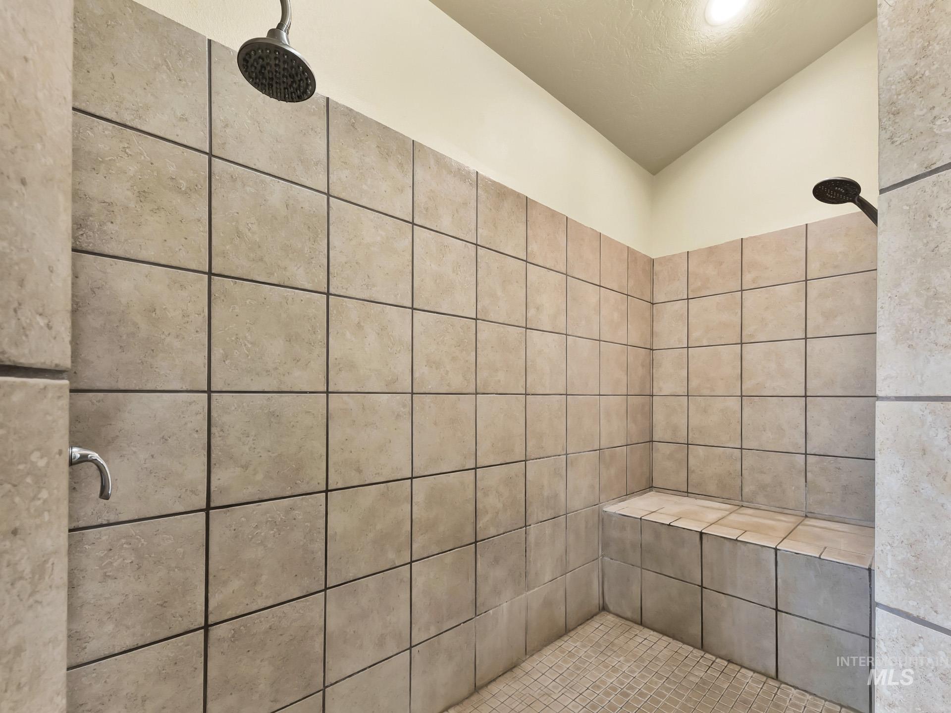 Full bathroom with a tile shower