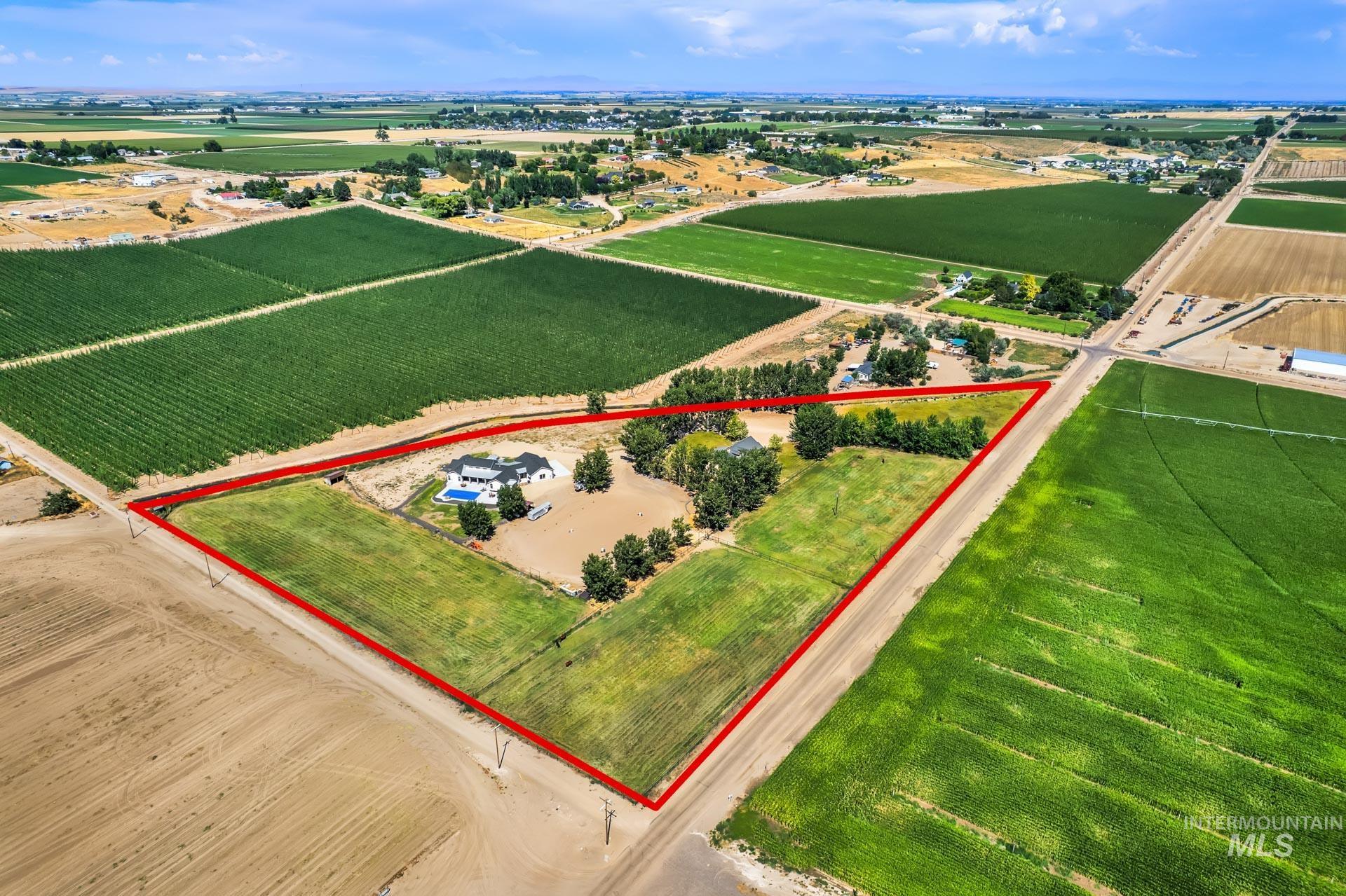 Overview of rural landscape with large plots for crops and property boundaries highlighted