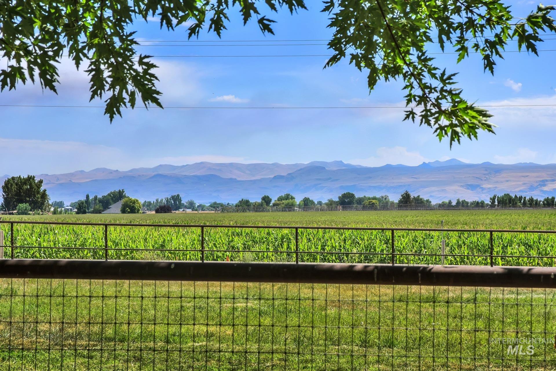 View of mountain background featuring rural landscape and a pastoral area