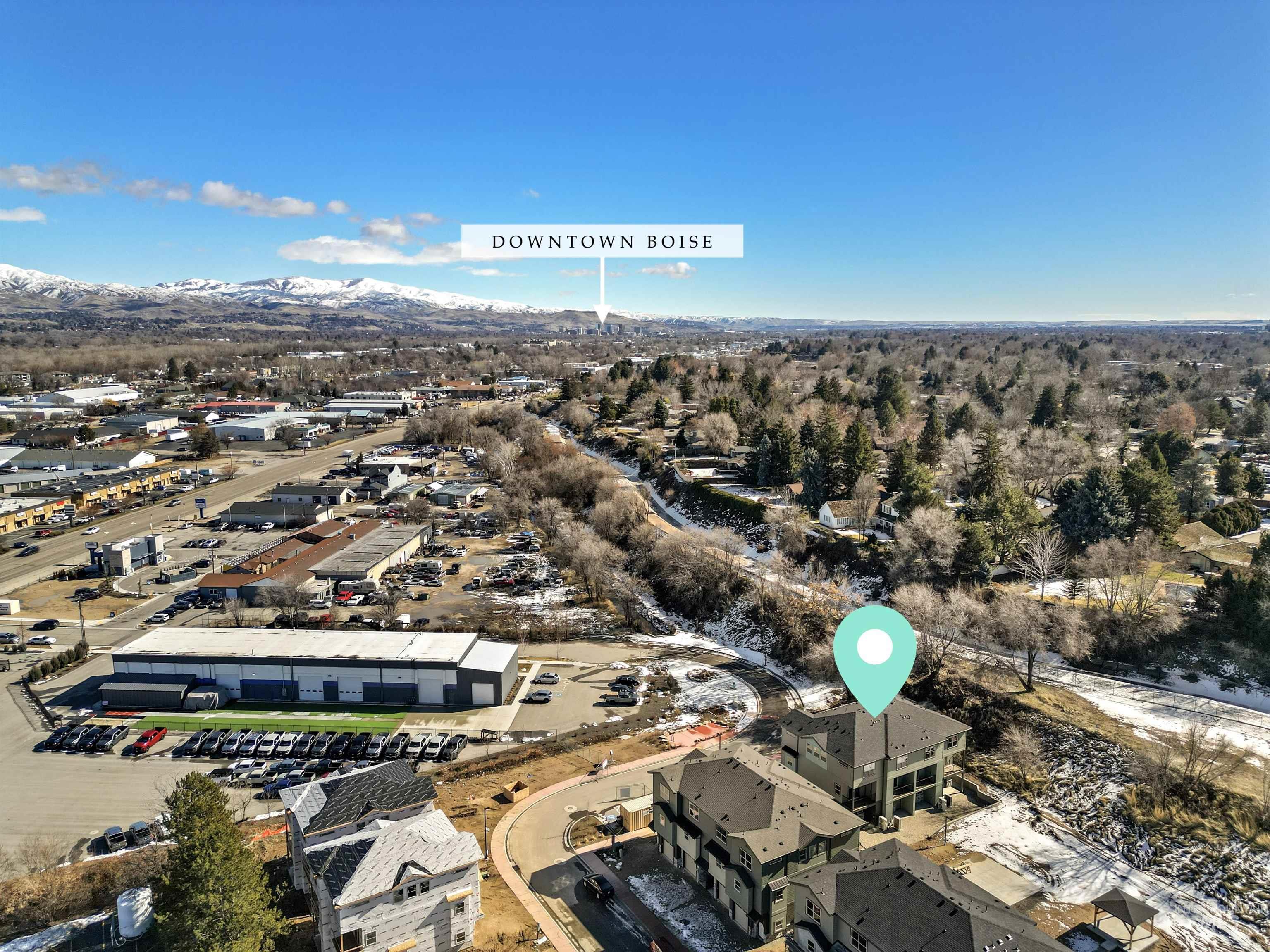 Aerial view of property and surrounding area with mountains