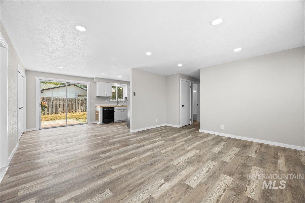 Unfurnished living room with recessed lighting and light wood finished floors