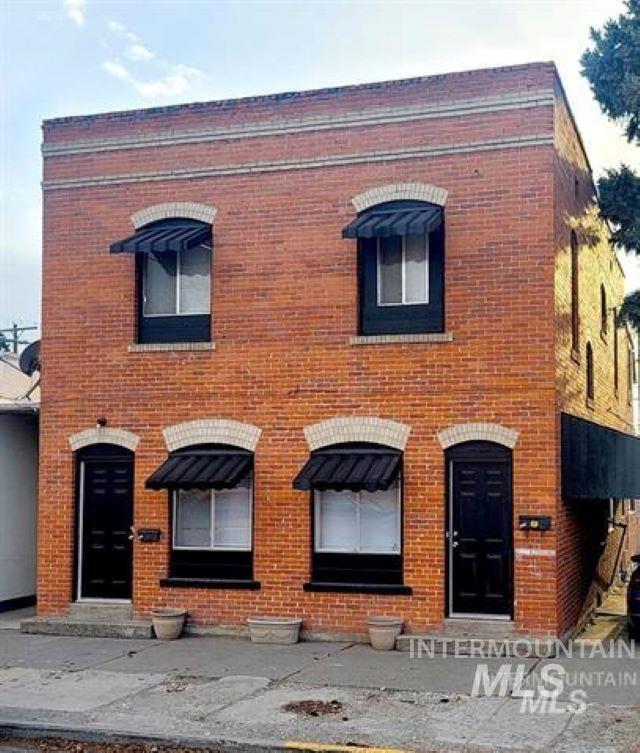 View of front of house with brick siding