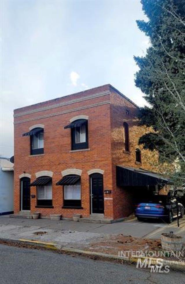 View of front of property featuring brick siding