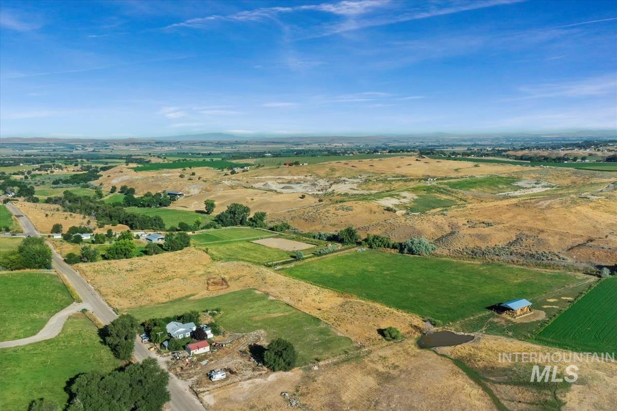 Aerial view of property and surrounding area with rural landscape