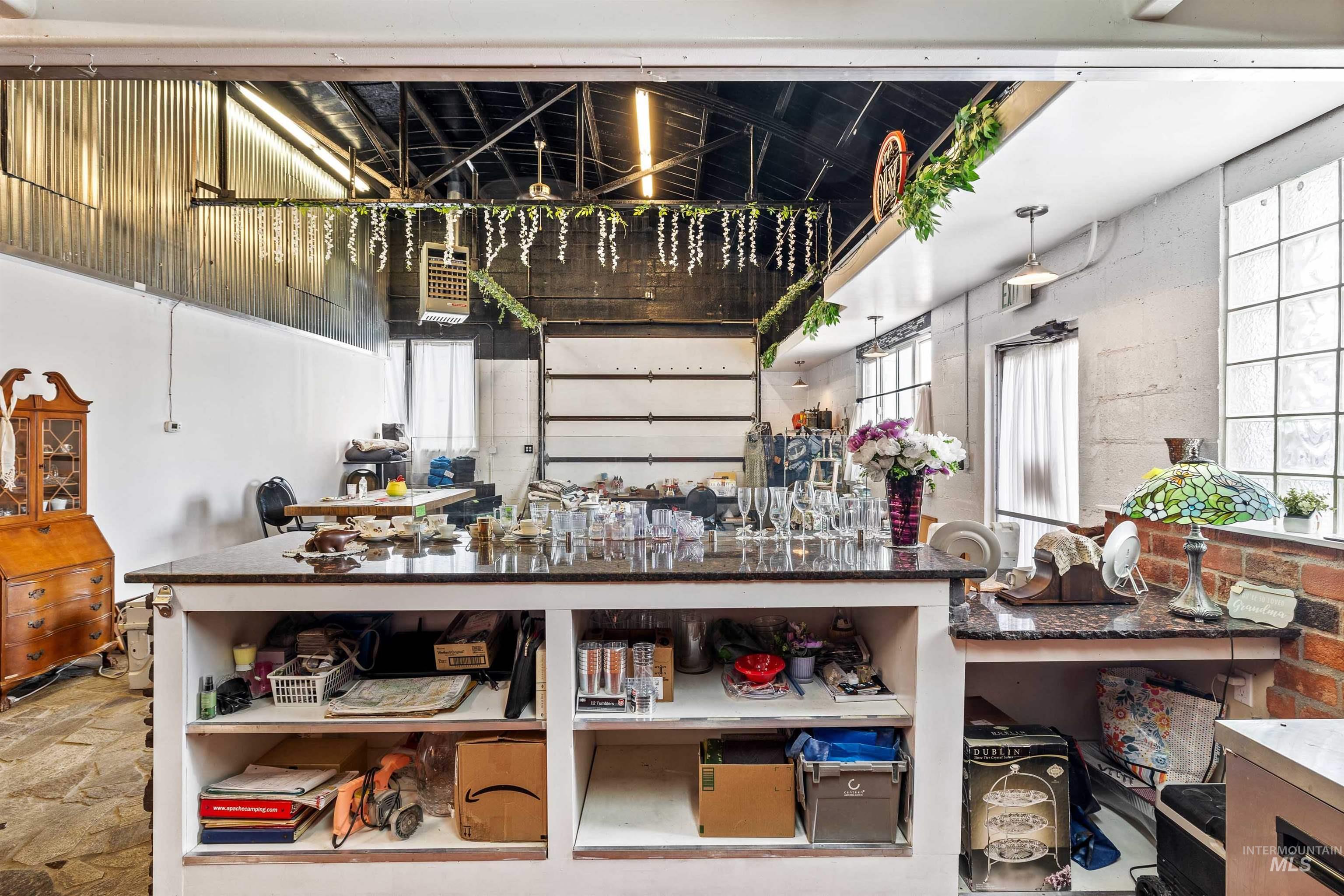 Kitchen featuring dark countertops