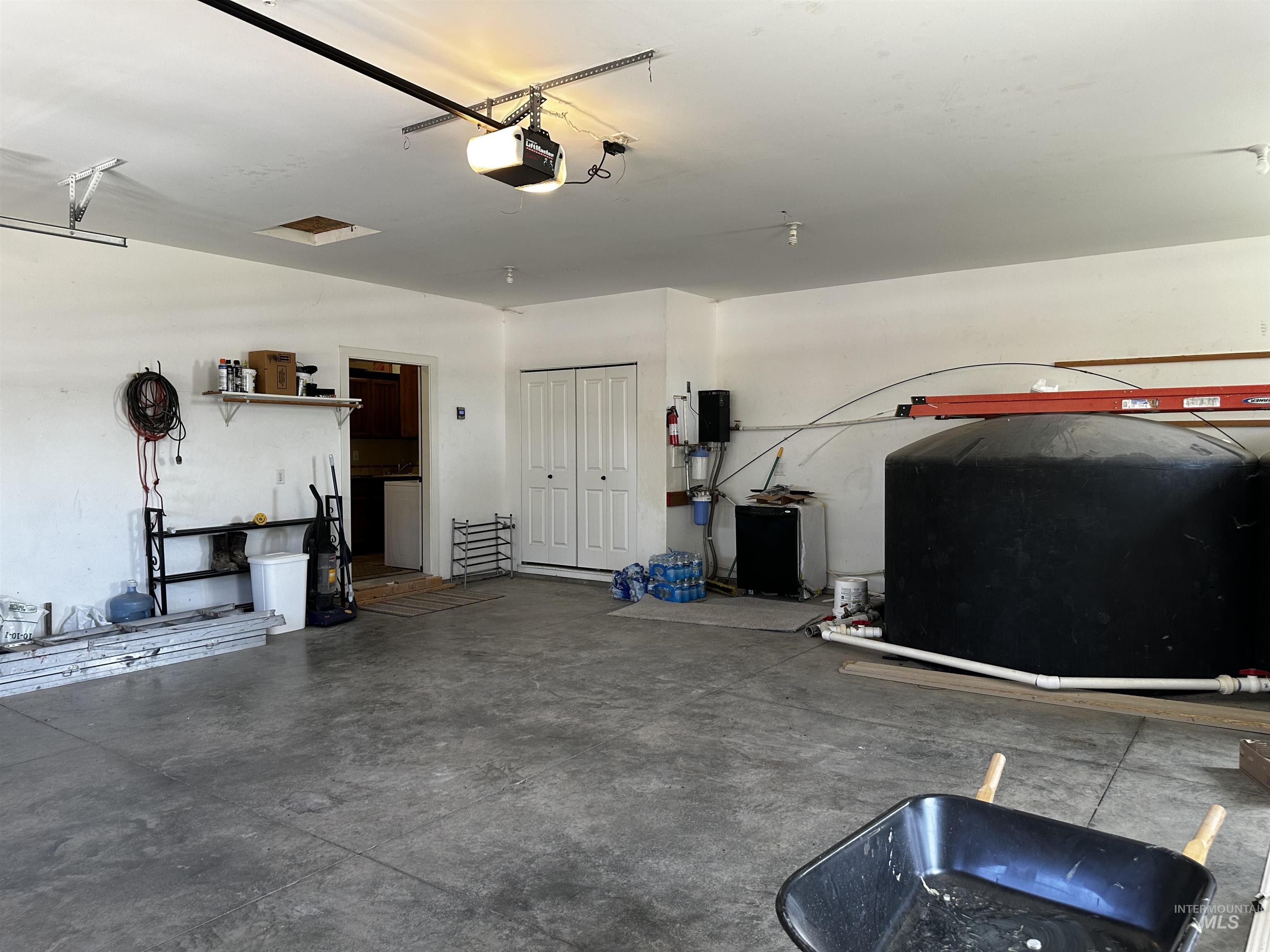 Garage featuring a garage door opener