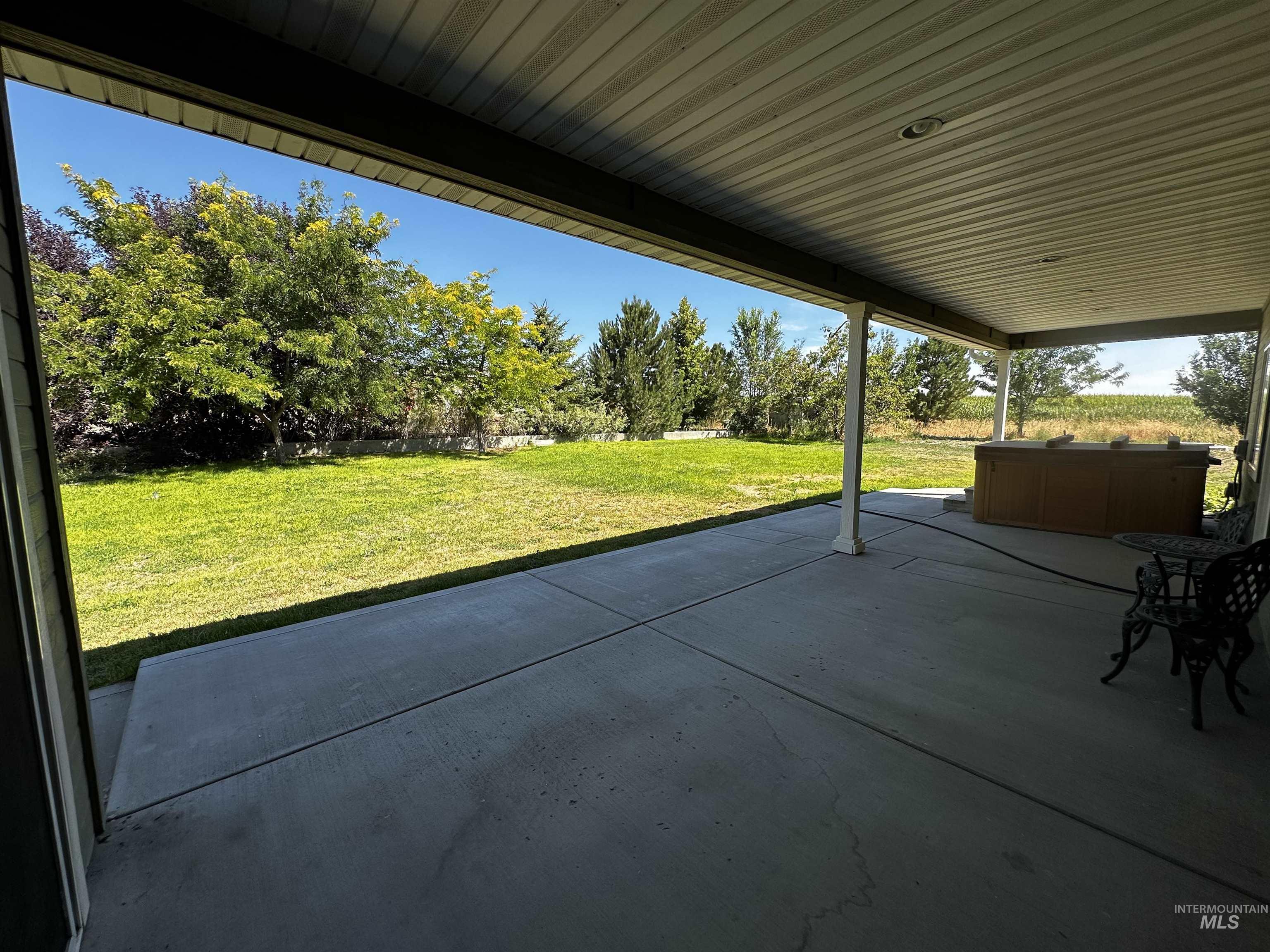 View of patio / terrace with a hot tub
